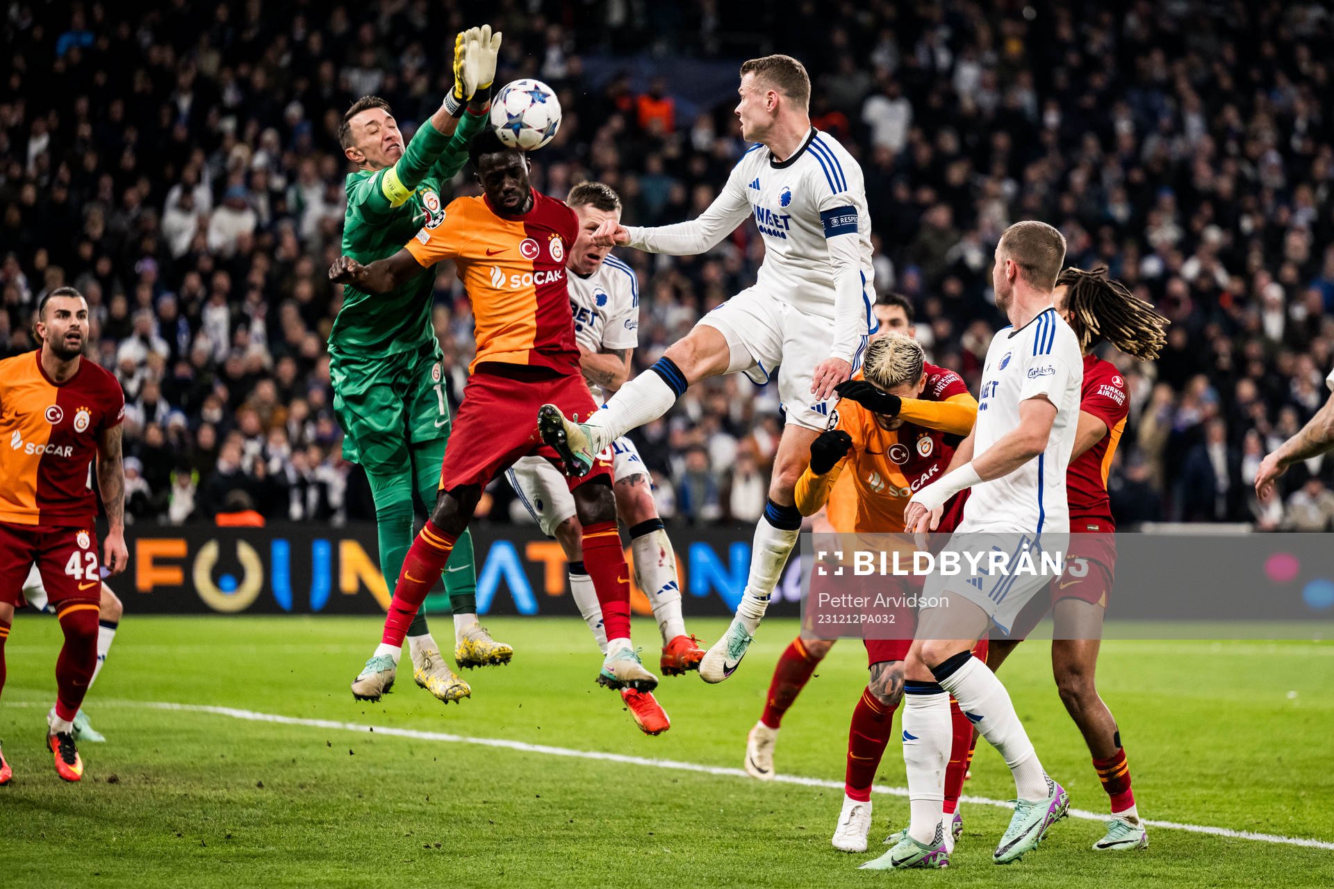 Goalkeeper Fernando Muslera and Davinson Sánchez of Galatasaray against Viktor Claesson of FC Copenhagen during the UEFA Champions League football match between FC Copenhagen and Galatasaray on December 12, 2023 in Copenhagen. 