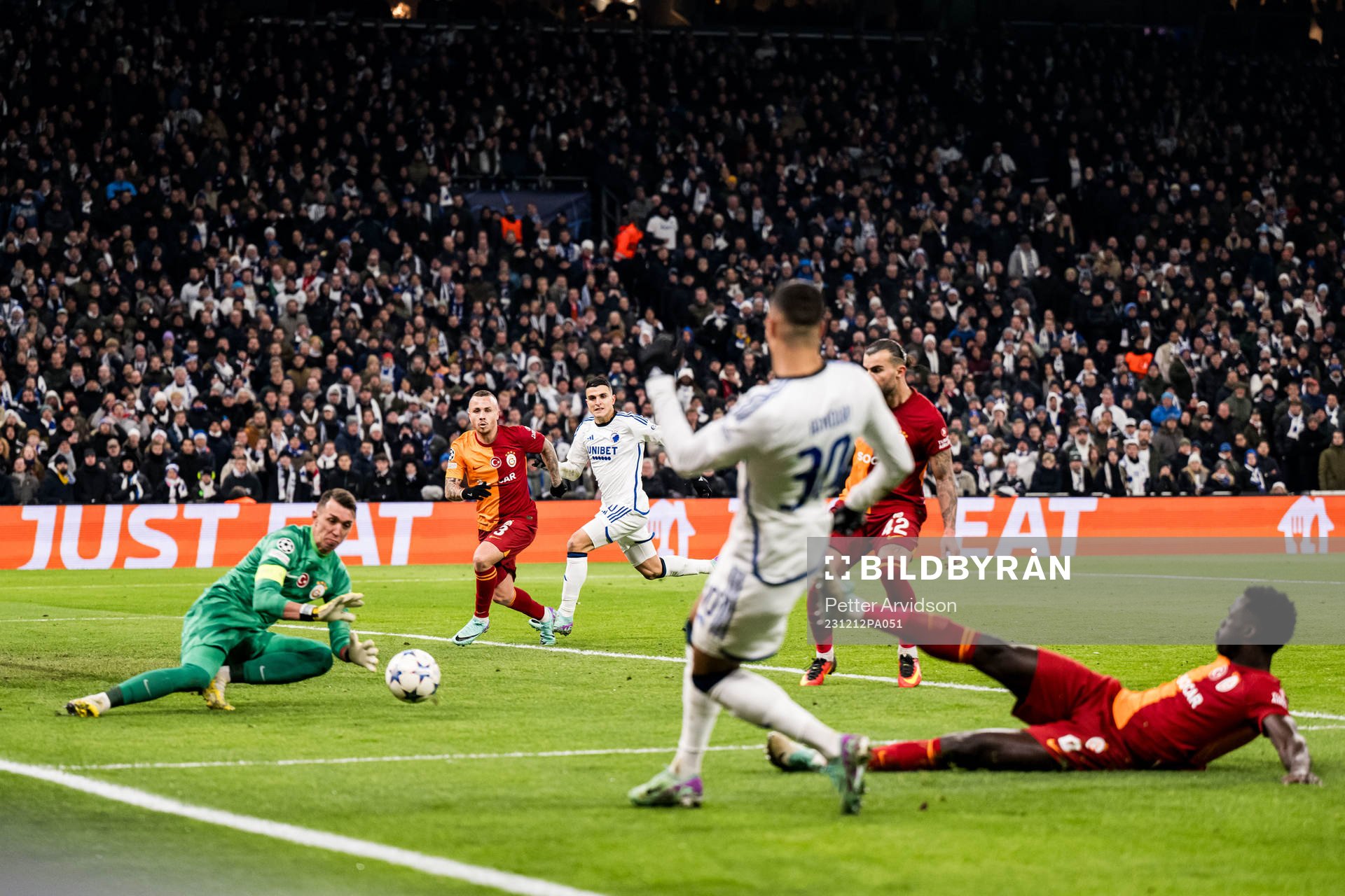 Elias Achouri and Mohamed Elyounoussi of FC Copenhagen against goalkeeper Fernando Muslera of Galatasaray during the UEFA Champions League football match between FC Copenhagen and Galatasaray on December 12, 2023 in Copenhagen.