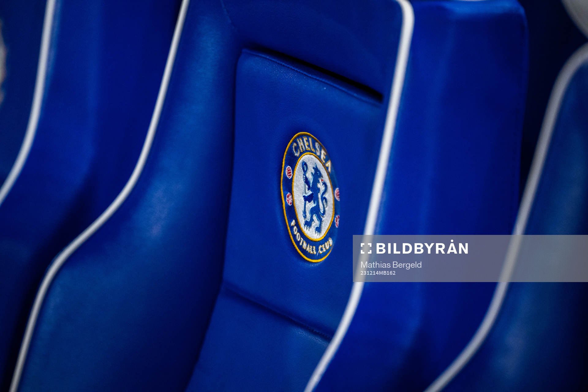 Chairs with the logo of Chelsea at the players bench