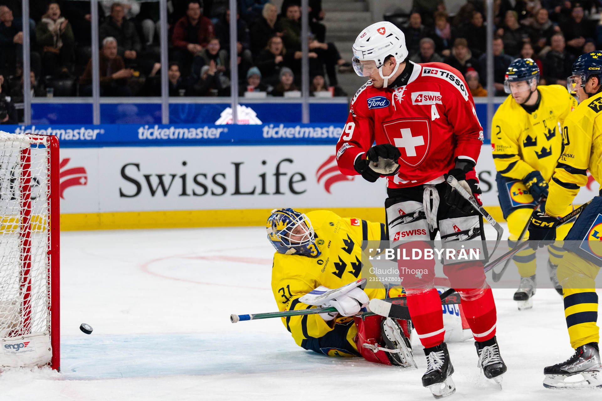 Goaltender Lars Johansson of Sweden looks dejected