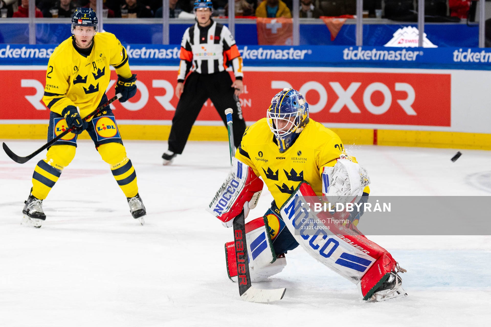 Christian Folin and goaltender Lars Johansson of Sweden in