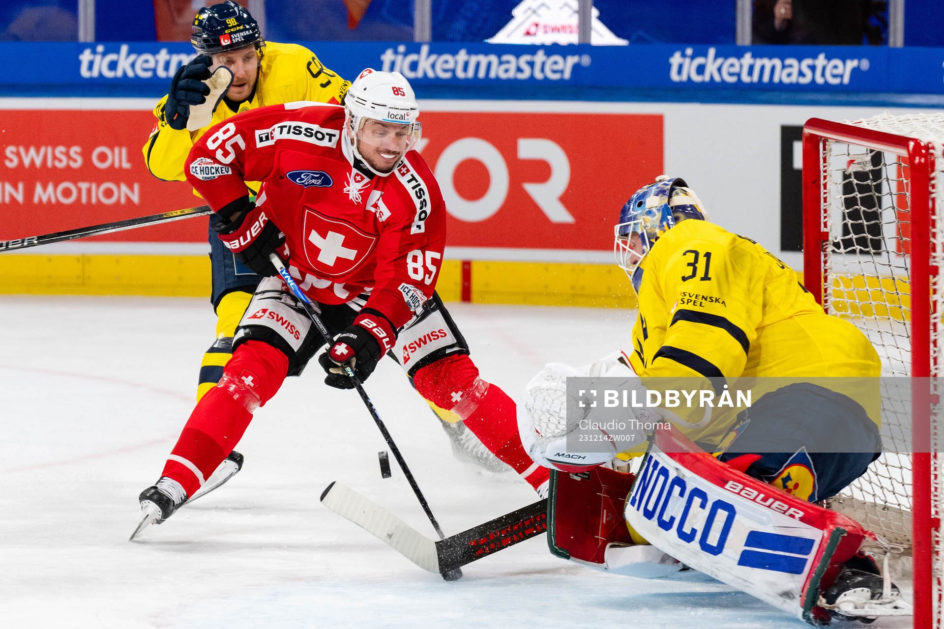 Sven Andrighetto of Switzerland and goaltender Lars