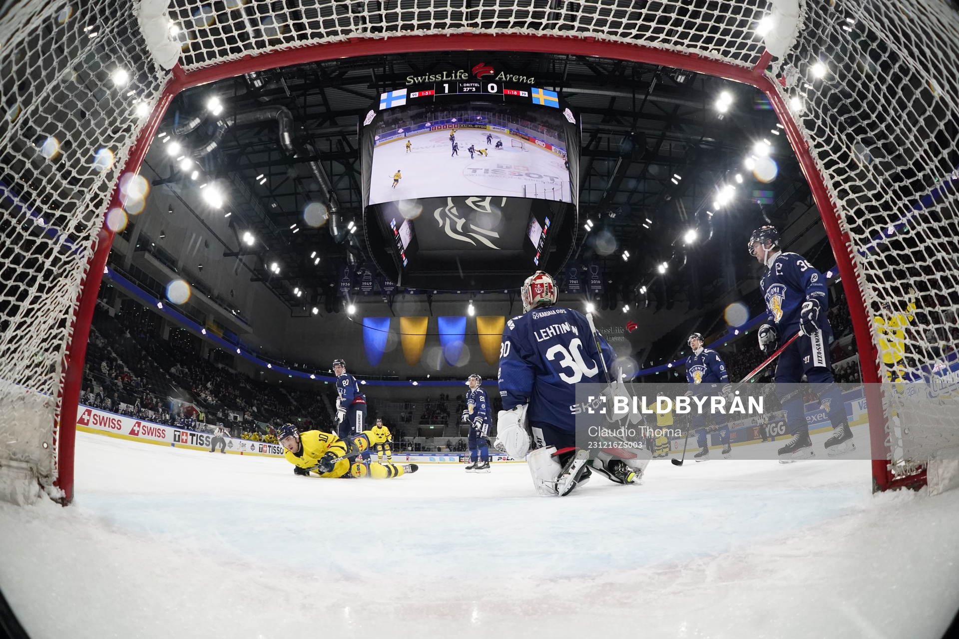 Andreas Wingerli of Sweden scores 1-1 in the ice hockey