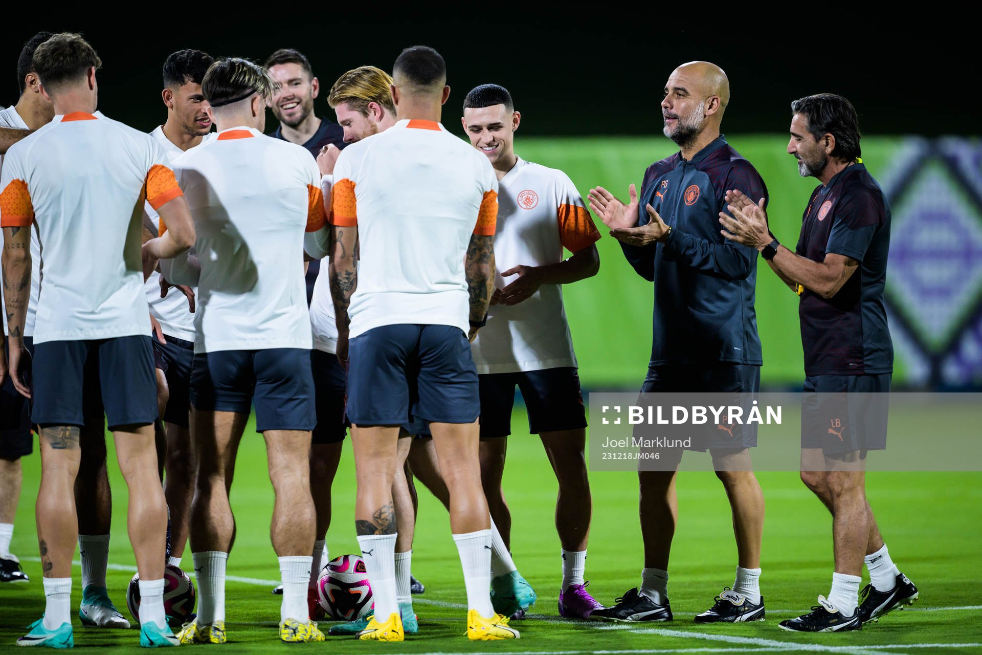 Kevin de Bruyne, Phil Foden and head coach Pep Guardiola of