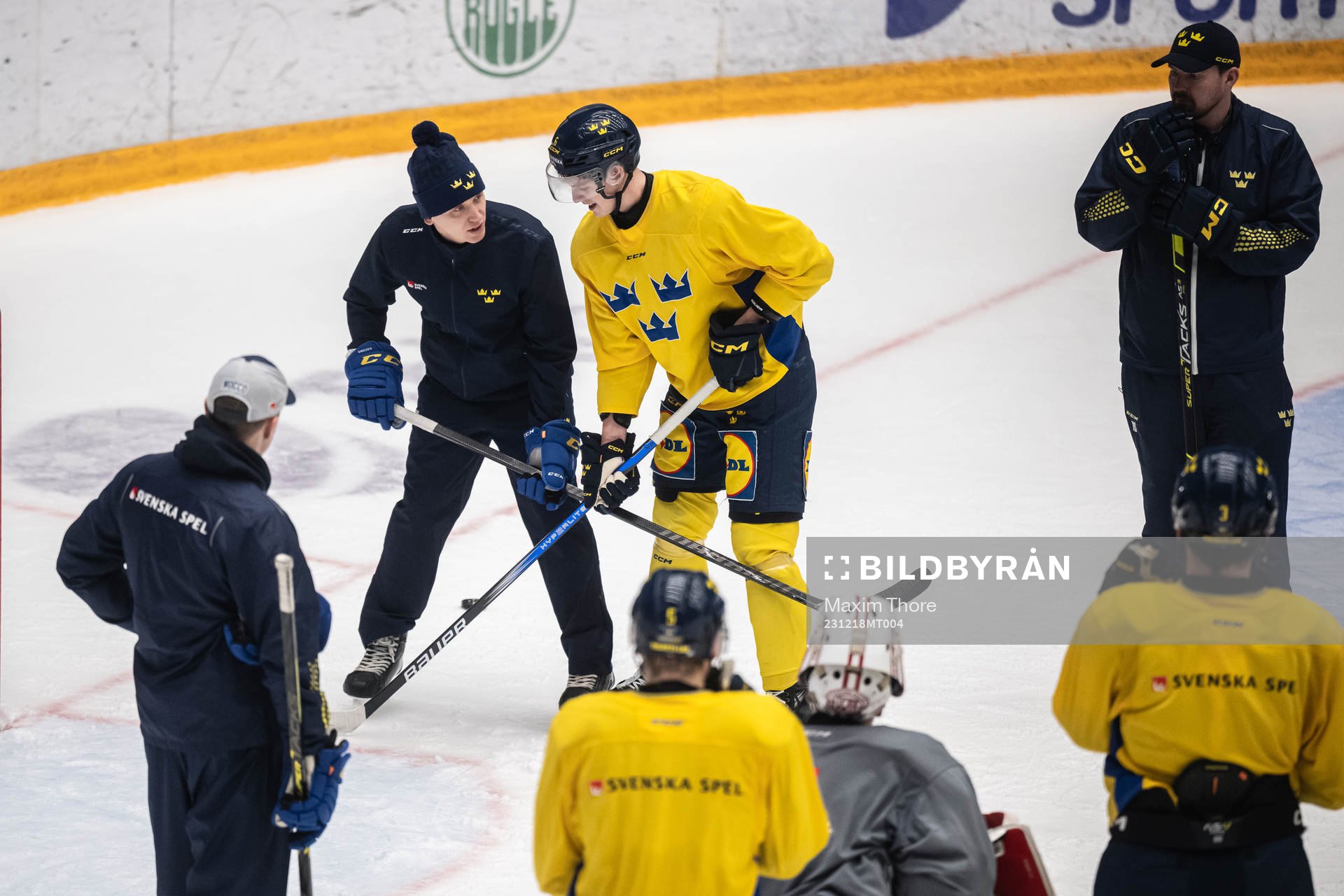 Goaltender coach Viktor Alm and Anton Johansson of the