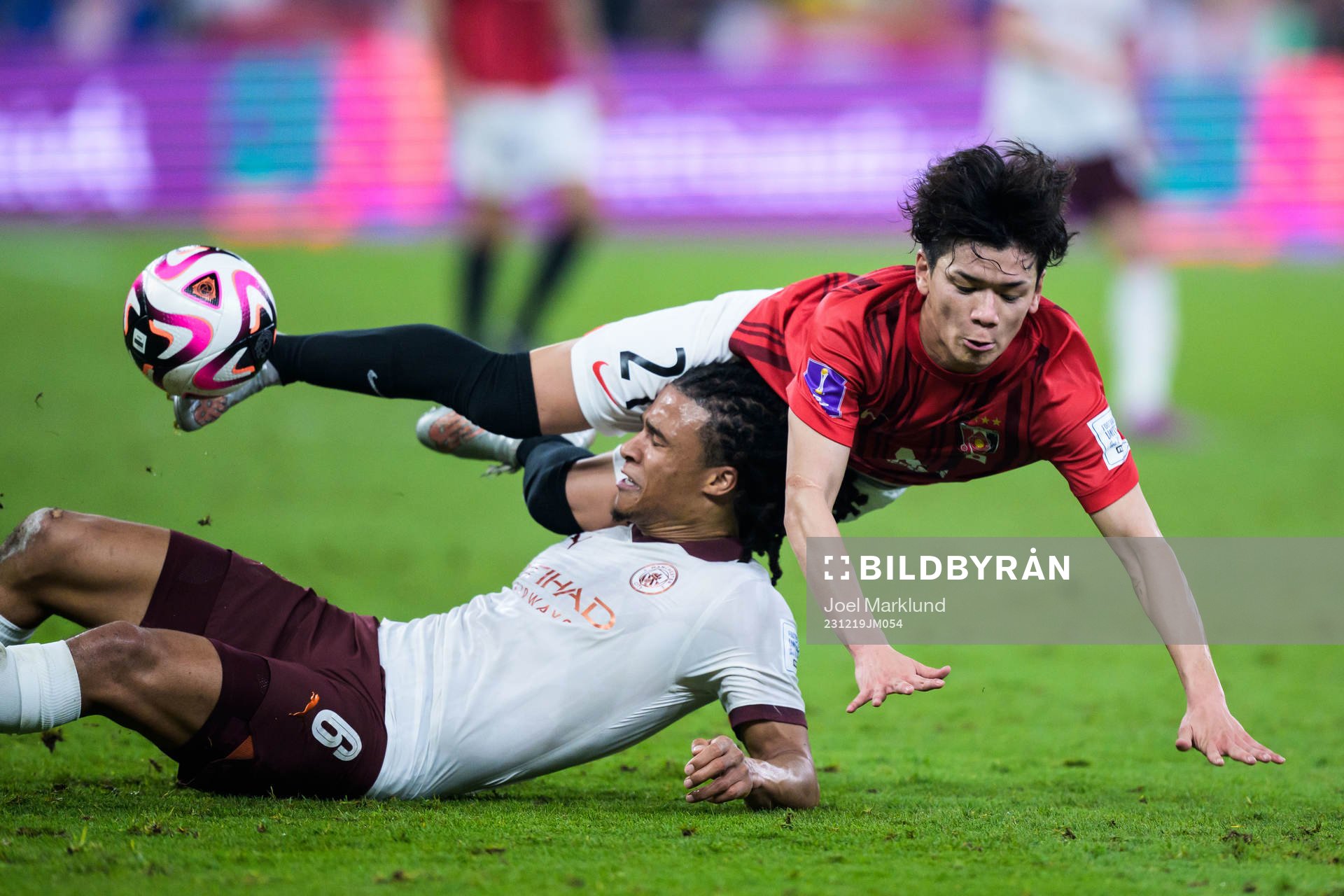 Nathan Ake of Manchester City and Tomoaki Okubo of Urawa