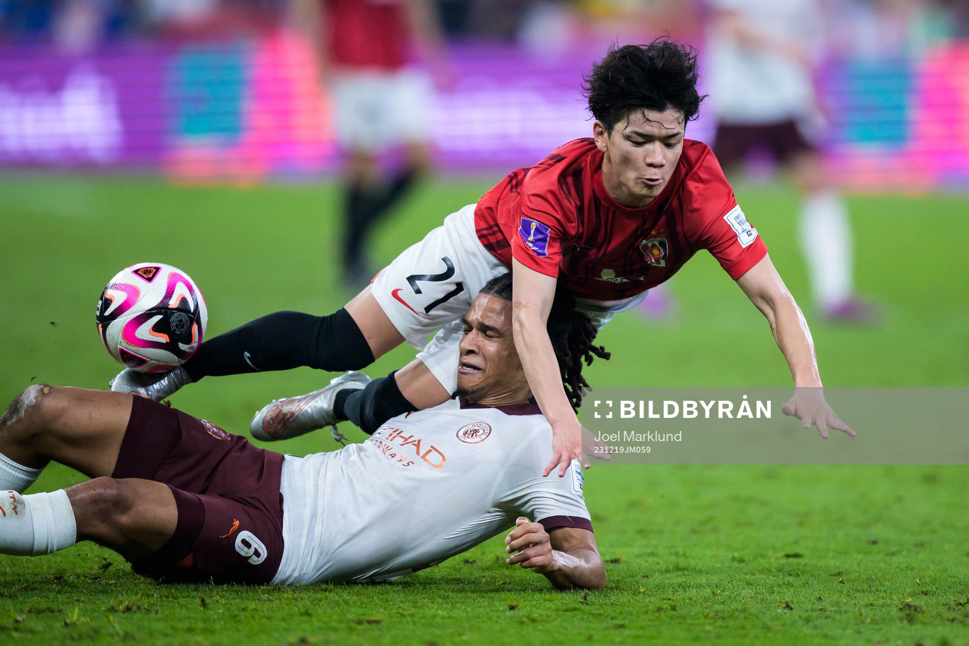 Nathan Ake of Manchester City and Tomoaki Okubo of Urawa
