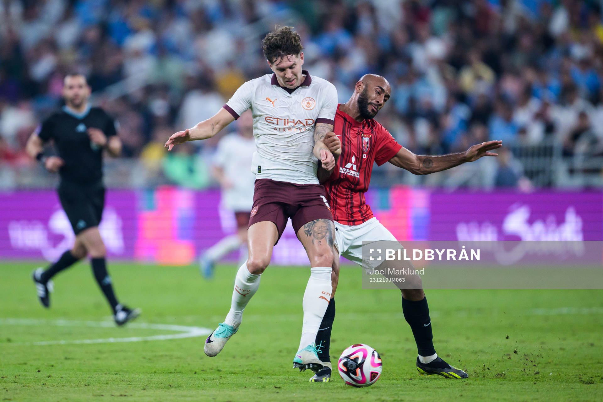 John Stones of Manchester City and Jose Kante of Urawa Reds