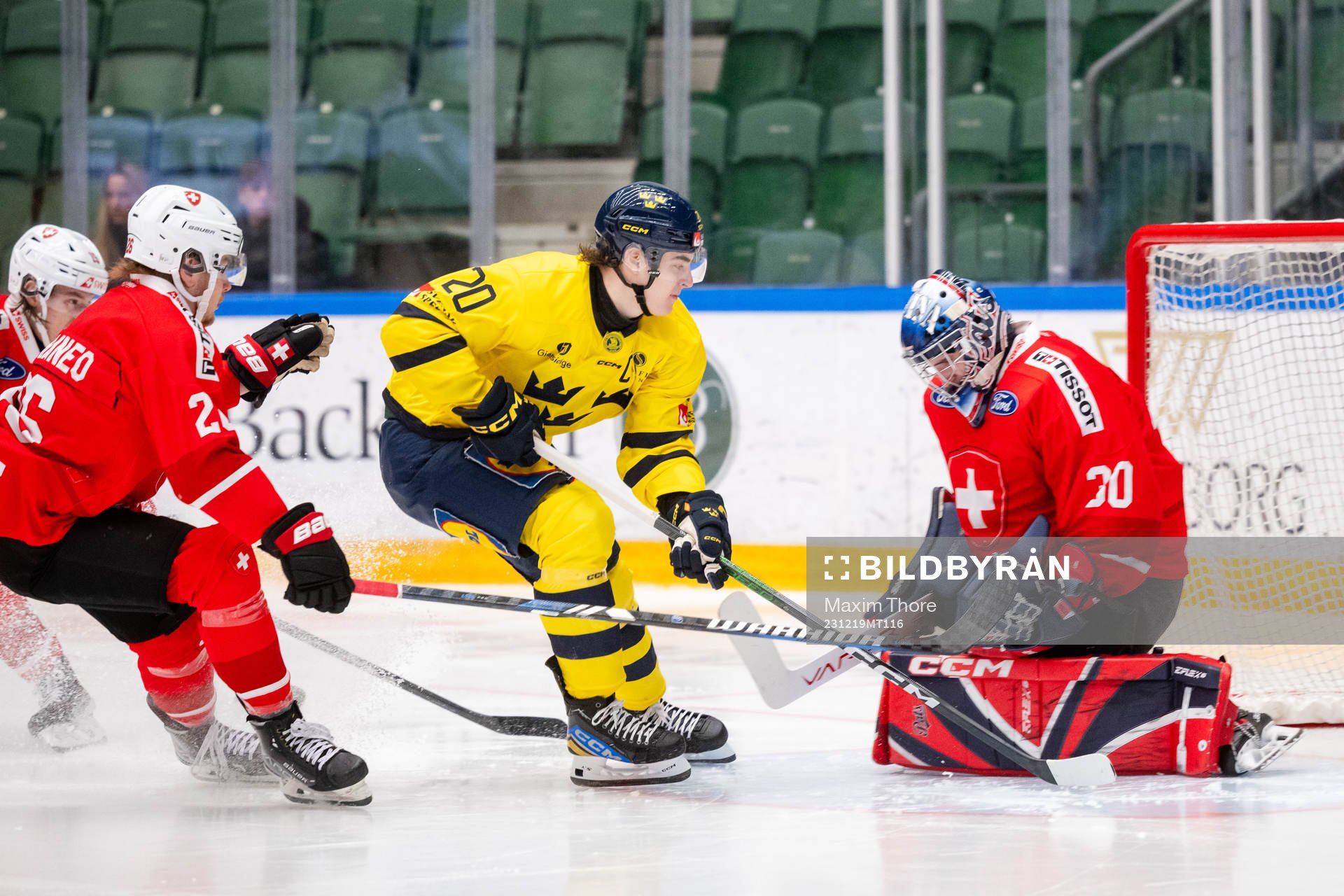 Liam Öhgren of Sweden against goaltender Ewan Huet of