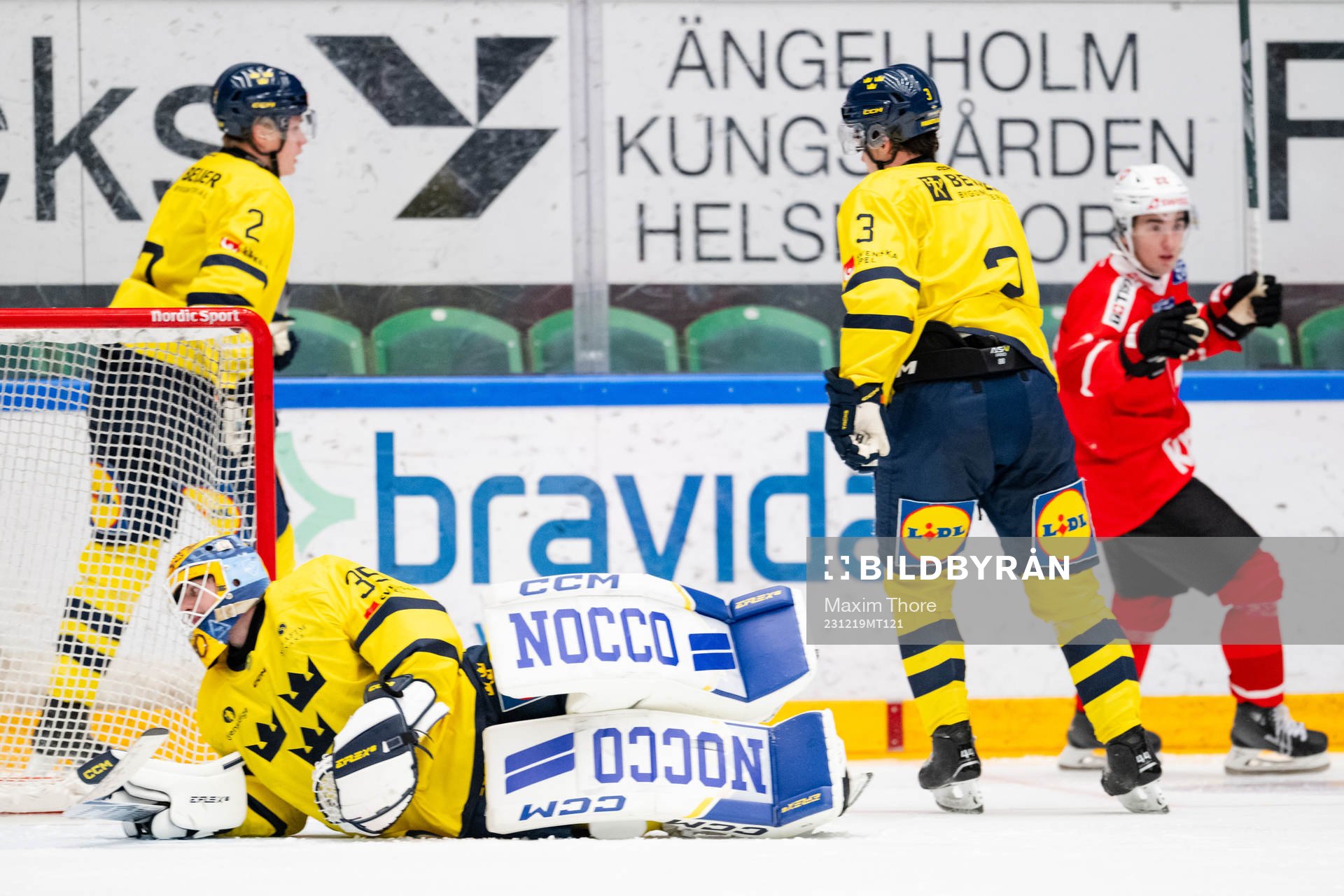 Goaltender Hugo Hävelid of Sweden looks dejected