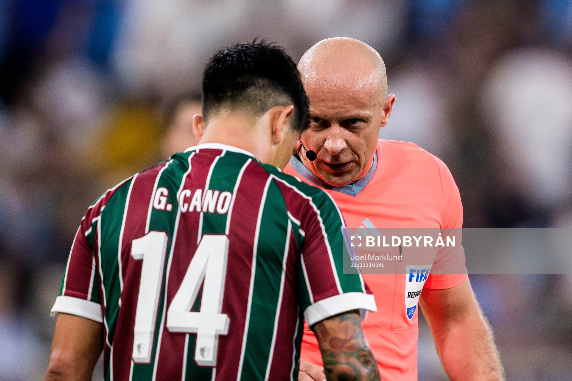 German Cano of Fluminense and referee Szymon Marciniak