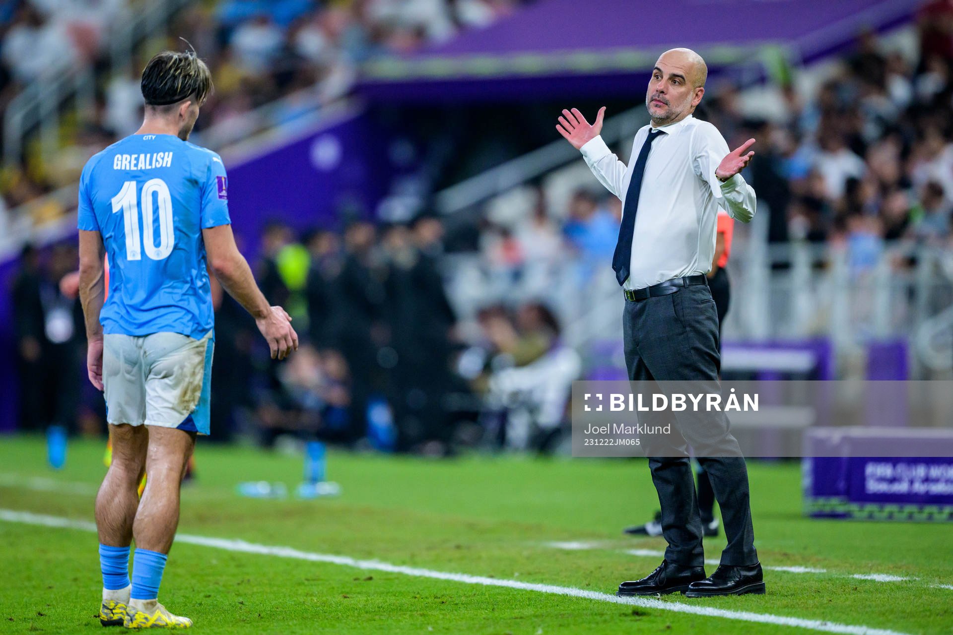 Jack Grealish and Head coach Pep Guardiola of Manchester