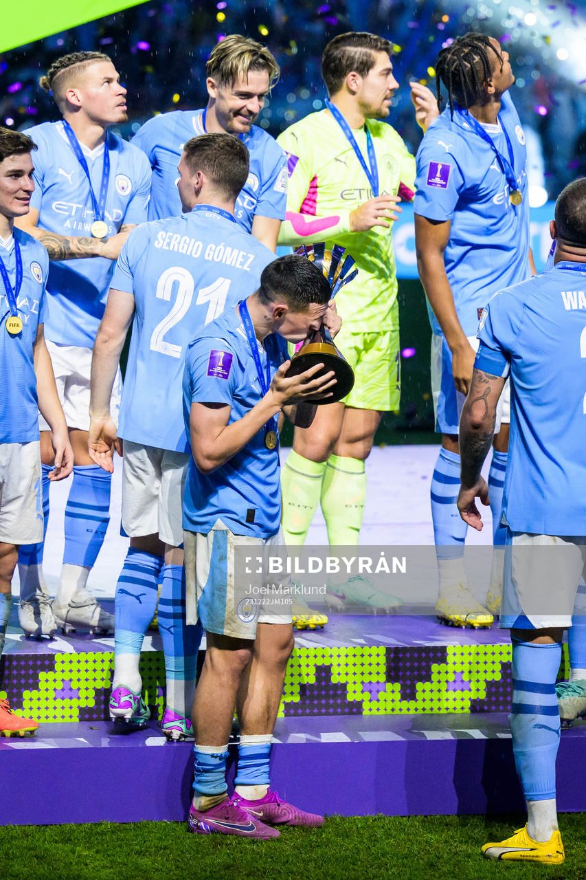 Phil Foden of Manchester City celebrates with the trophy