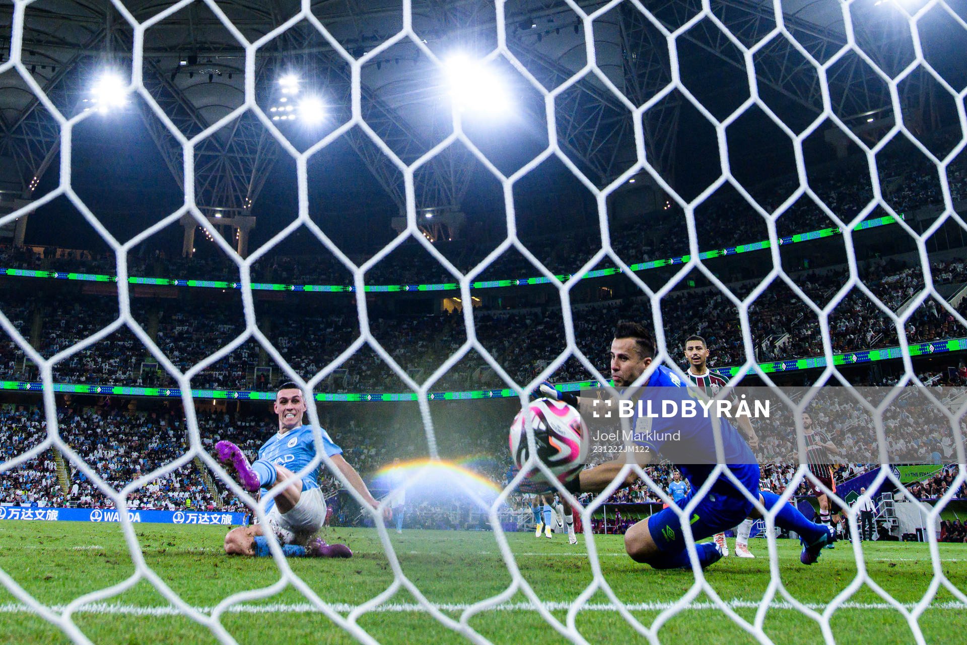 Phil Foden of Manchester City scores 0-3 behind goalkeeper