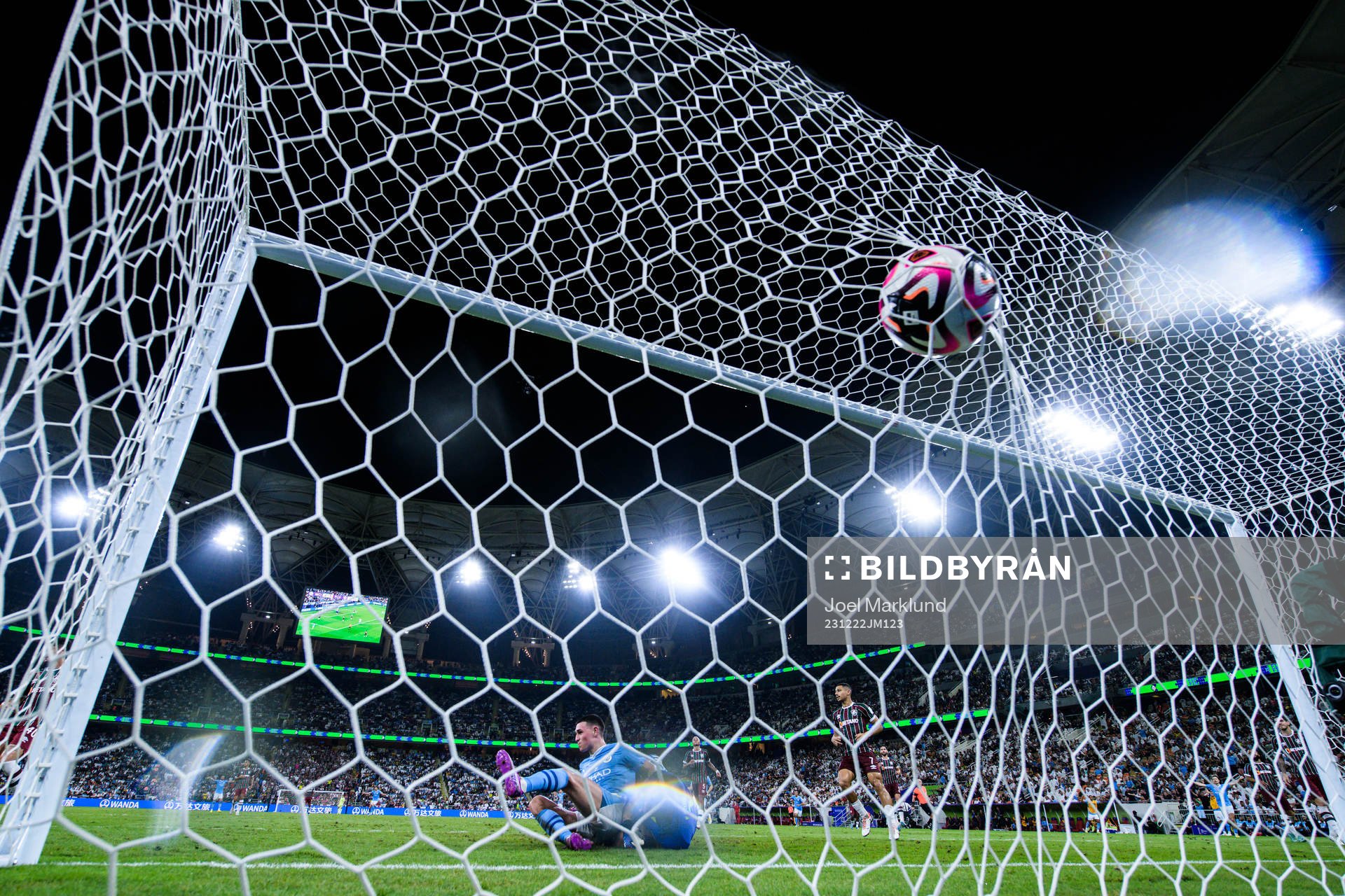 Phil Foden of Manchester City scores 0-3 behind goalkeeper