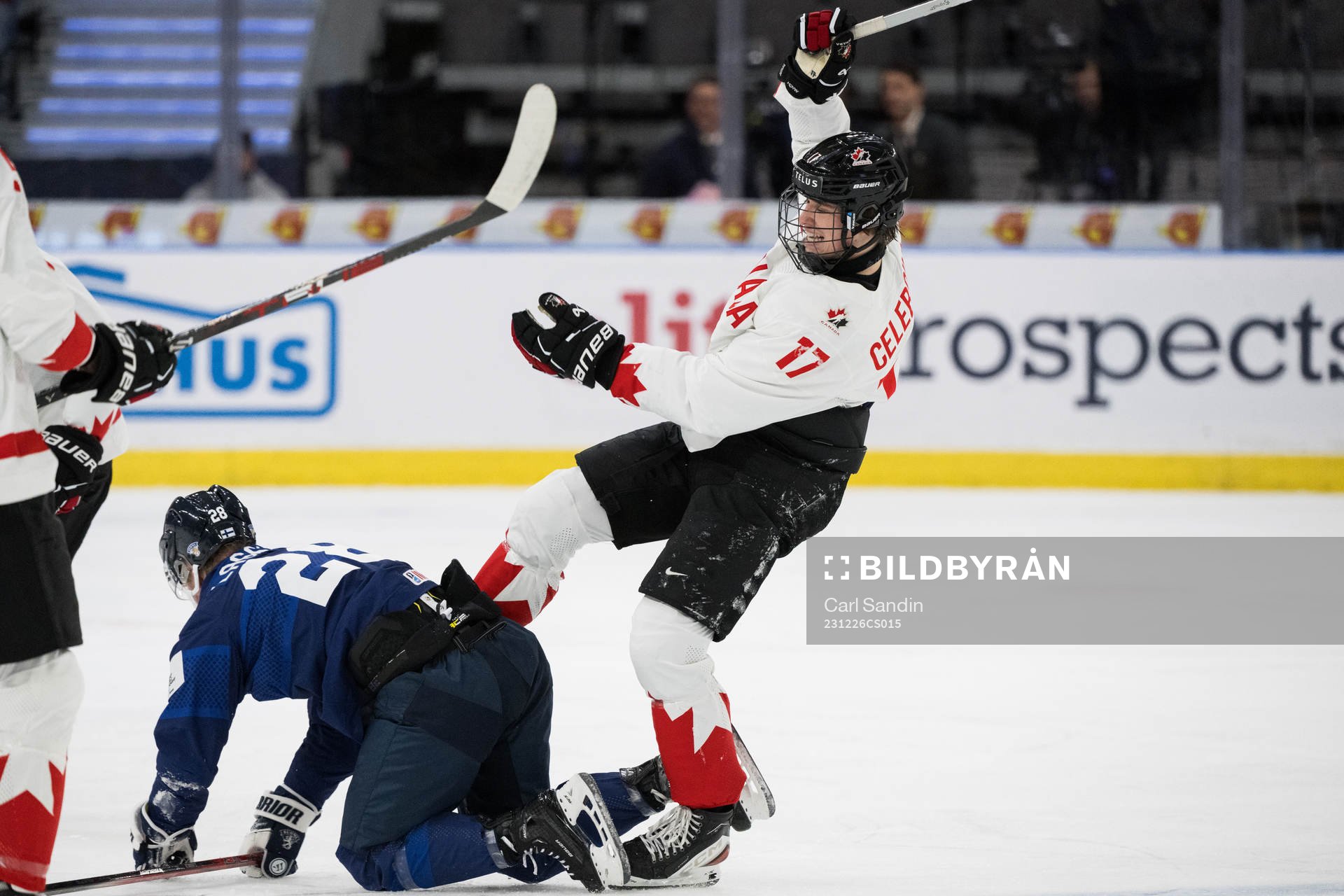 Jere Lassila of Finland and Macklin Celebrini of Canada