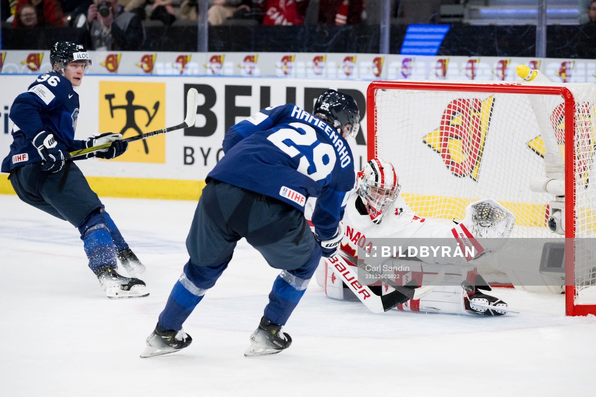 Goaltender Mathis Rousseau of Canada with a save