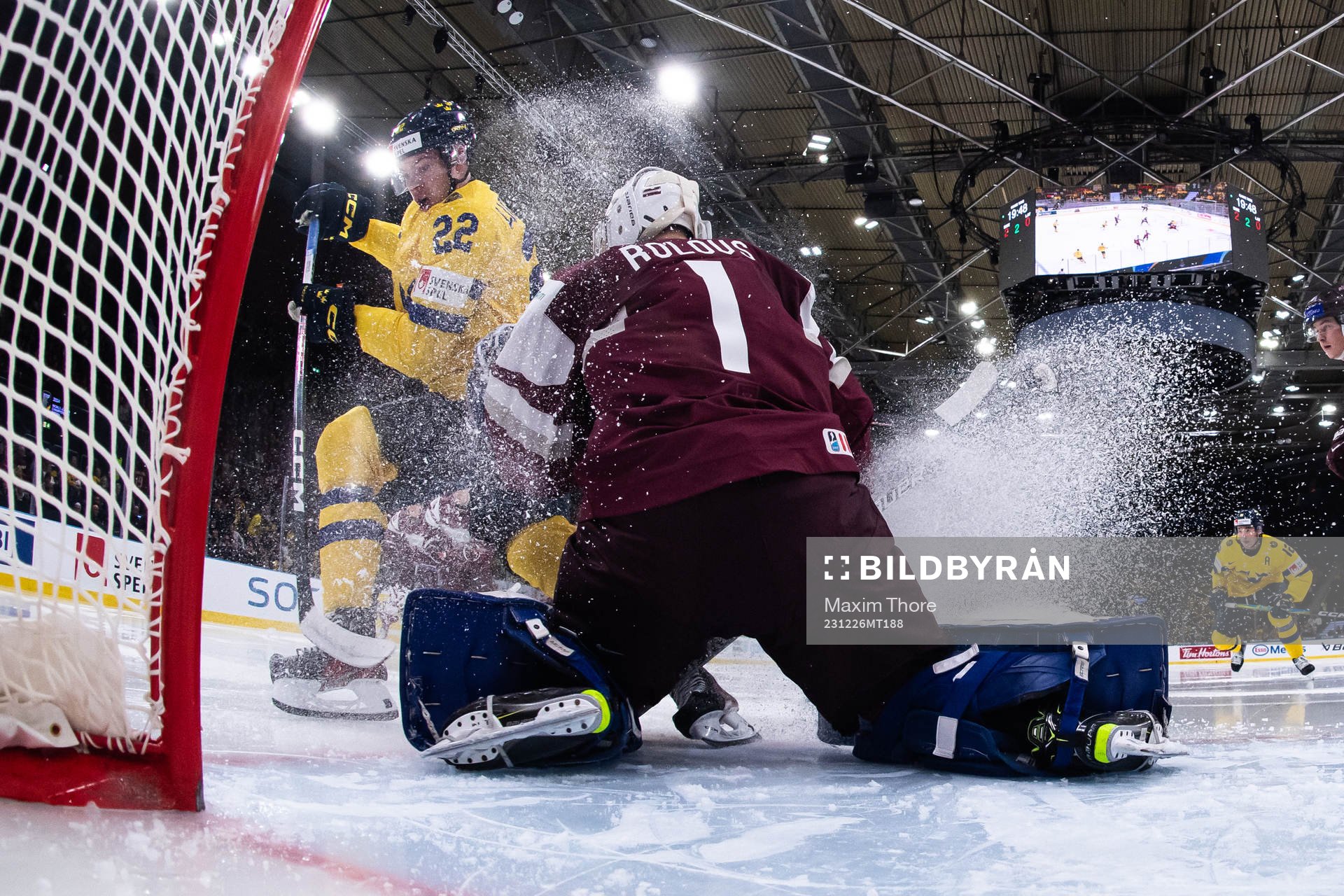 Anton Wahlberg of Sweden and goaltender Deivs Rolovs of