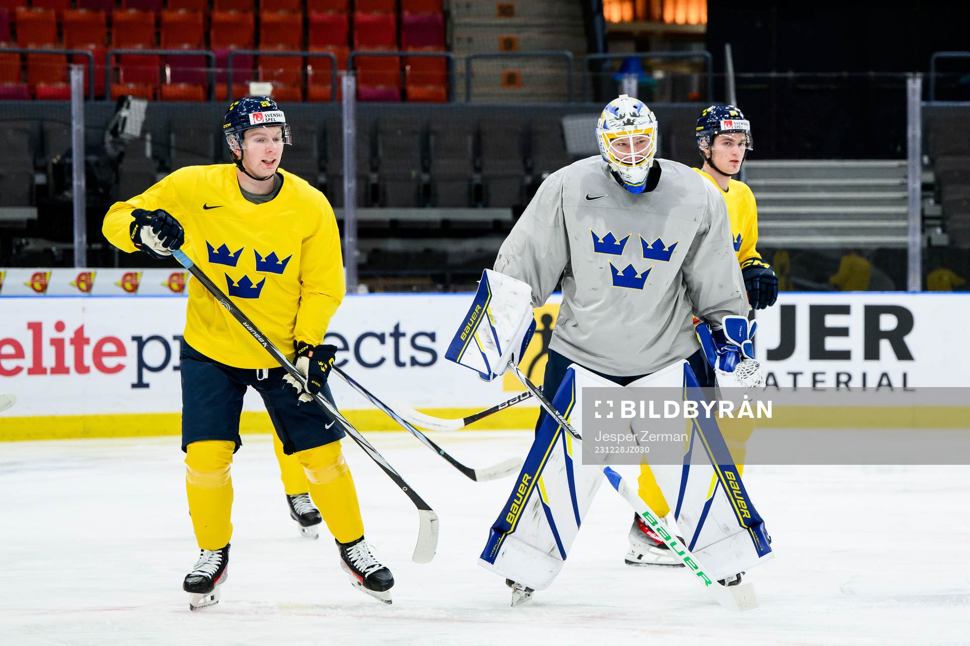 Otto Stenberg and goaltender Melker Thelin of Sweden at a