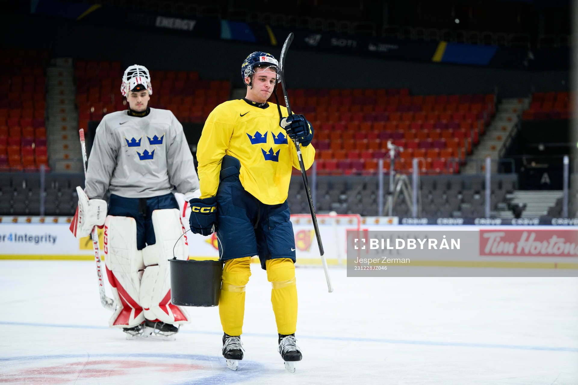 goaltender Kevin Reidler and Elias Salomonsson of Sweden at