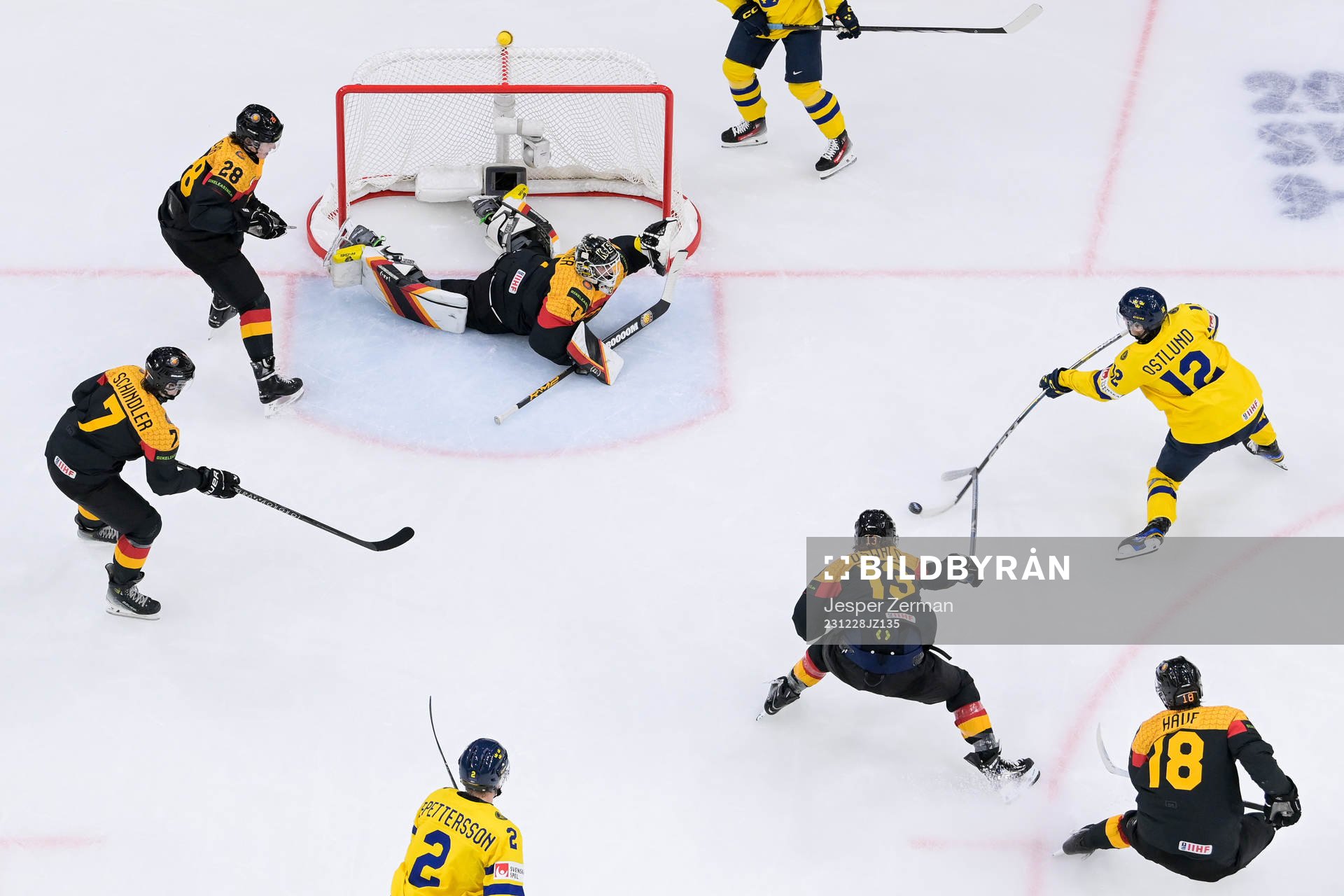 goaltender Matthias Bittner of Germany and Noah Östlund of