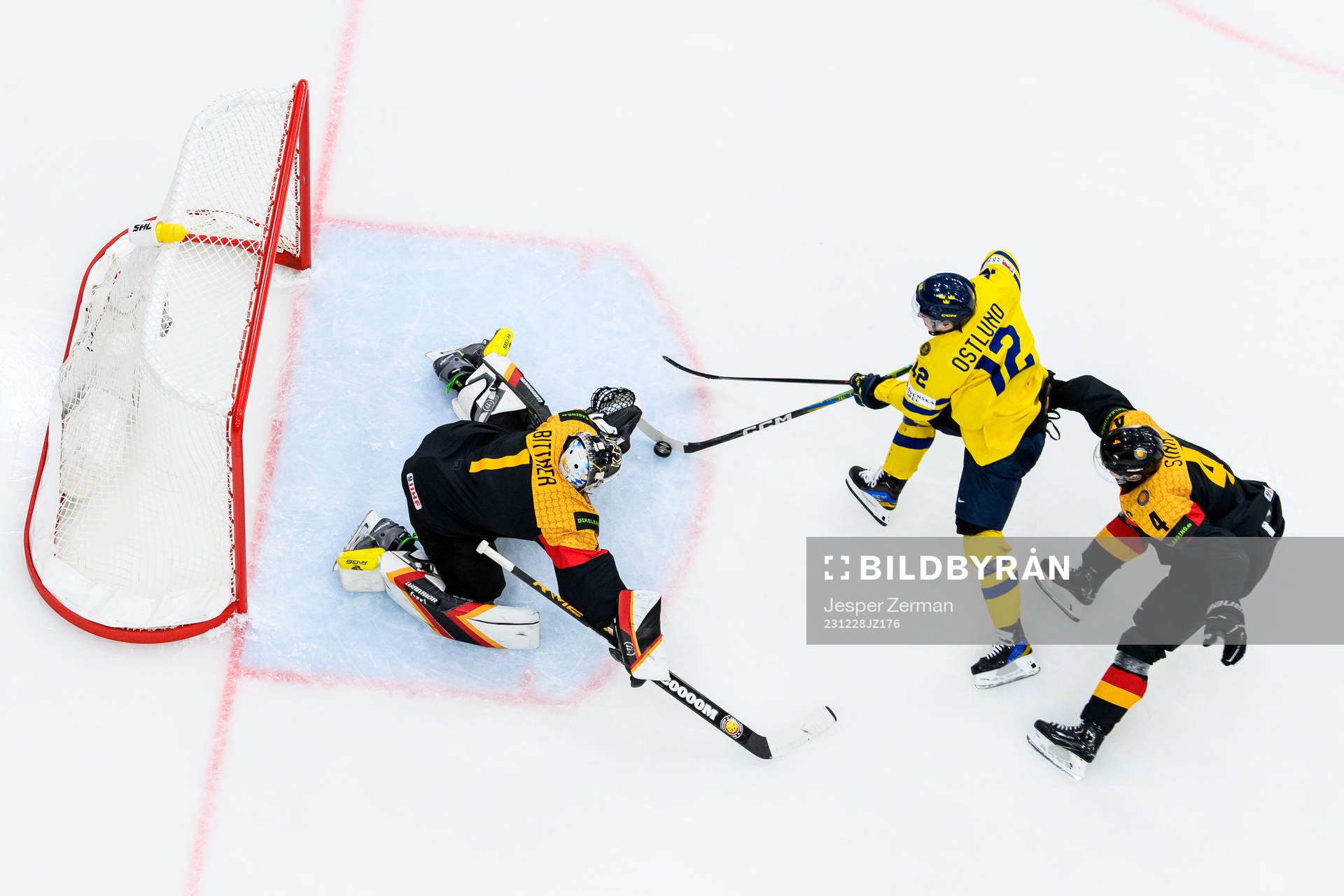 goaltender Matthias Bittner and Phillip Sinn of Germany