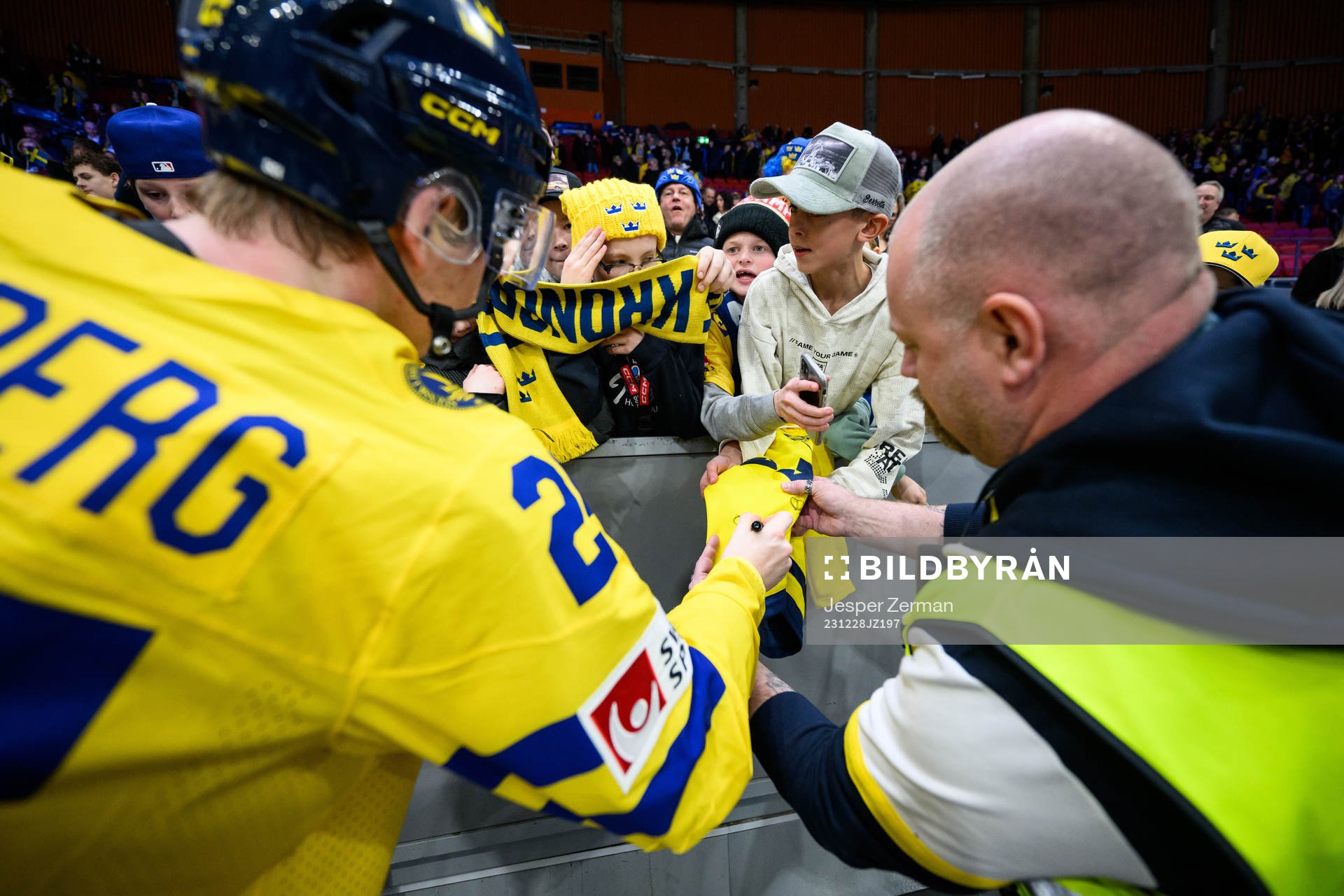 Otto Stenberg of Sweden signs a jersey for a fan