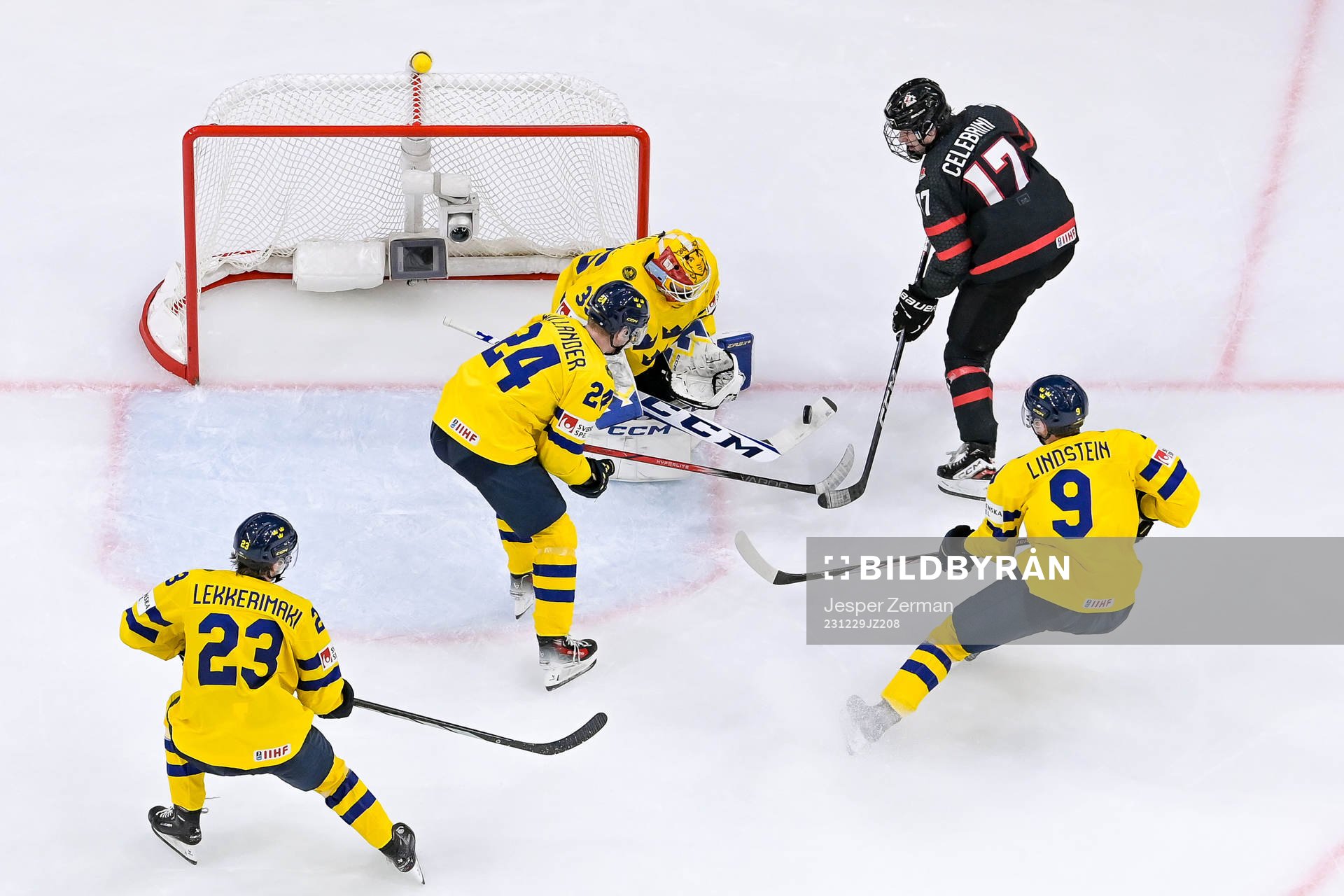 Macklin Celebrini of Canada against goaltender Hugo