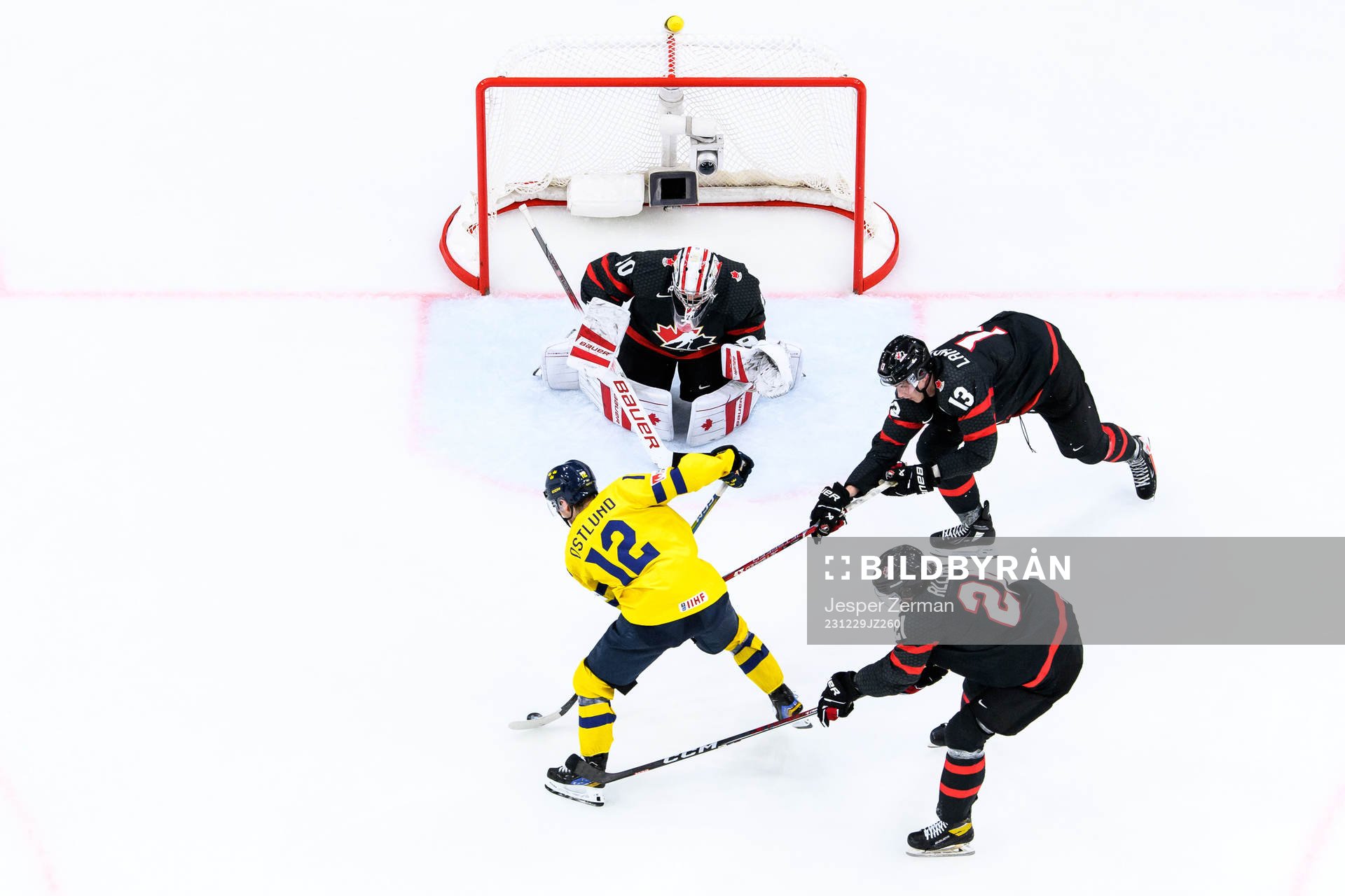 Noah Östlund of Sweden against goalkeeper Mathis Rousseau,
