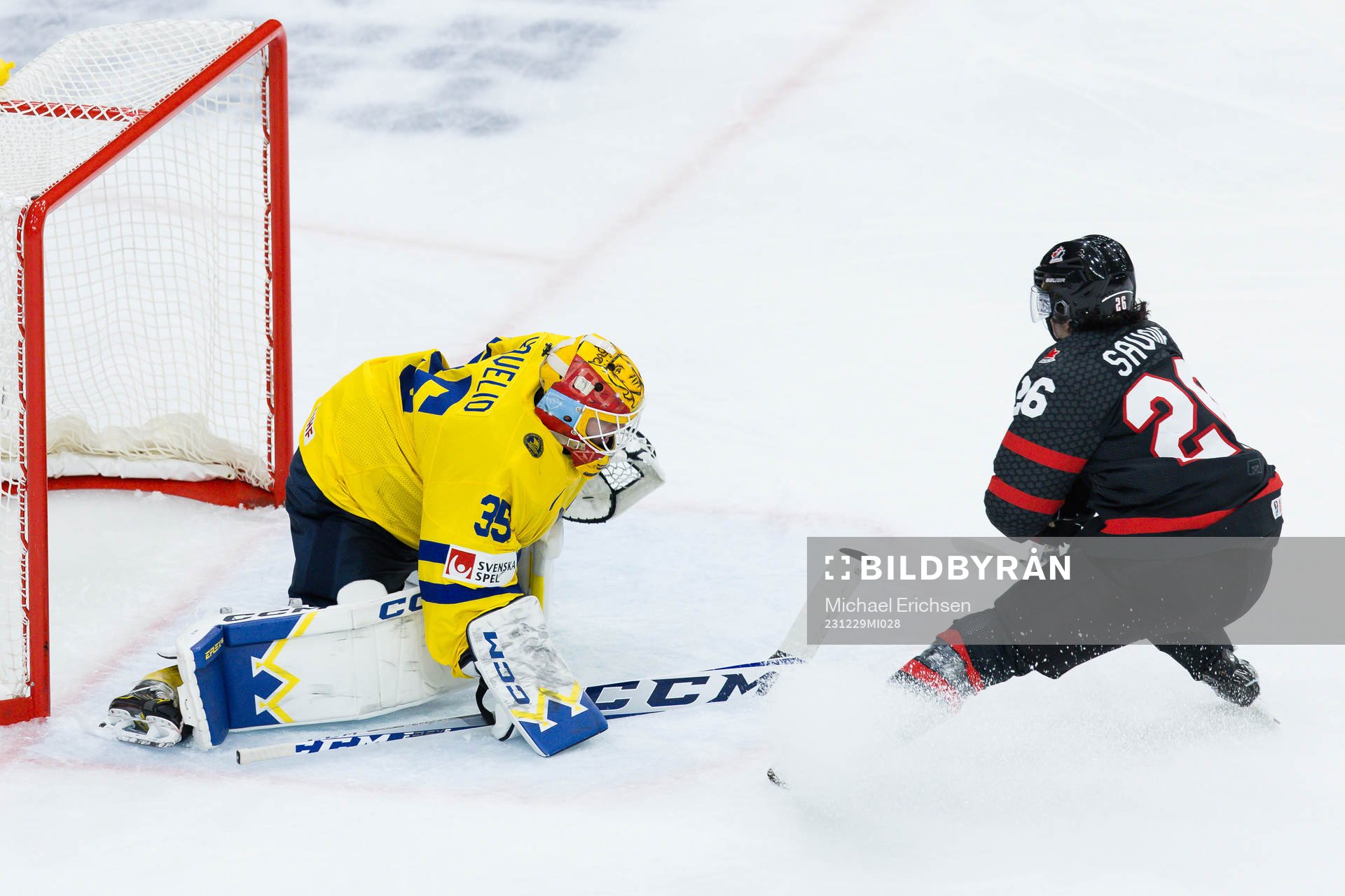 Goaltender Hugo Hävelid of Sweden and Matthew Savoie of