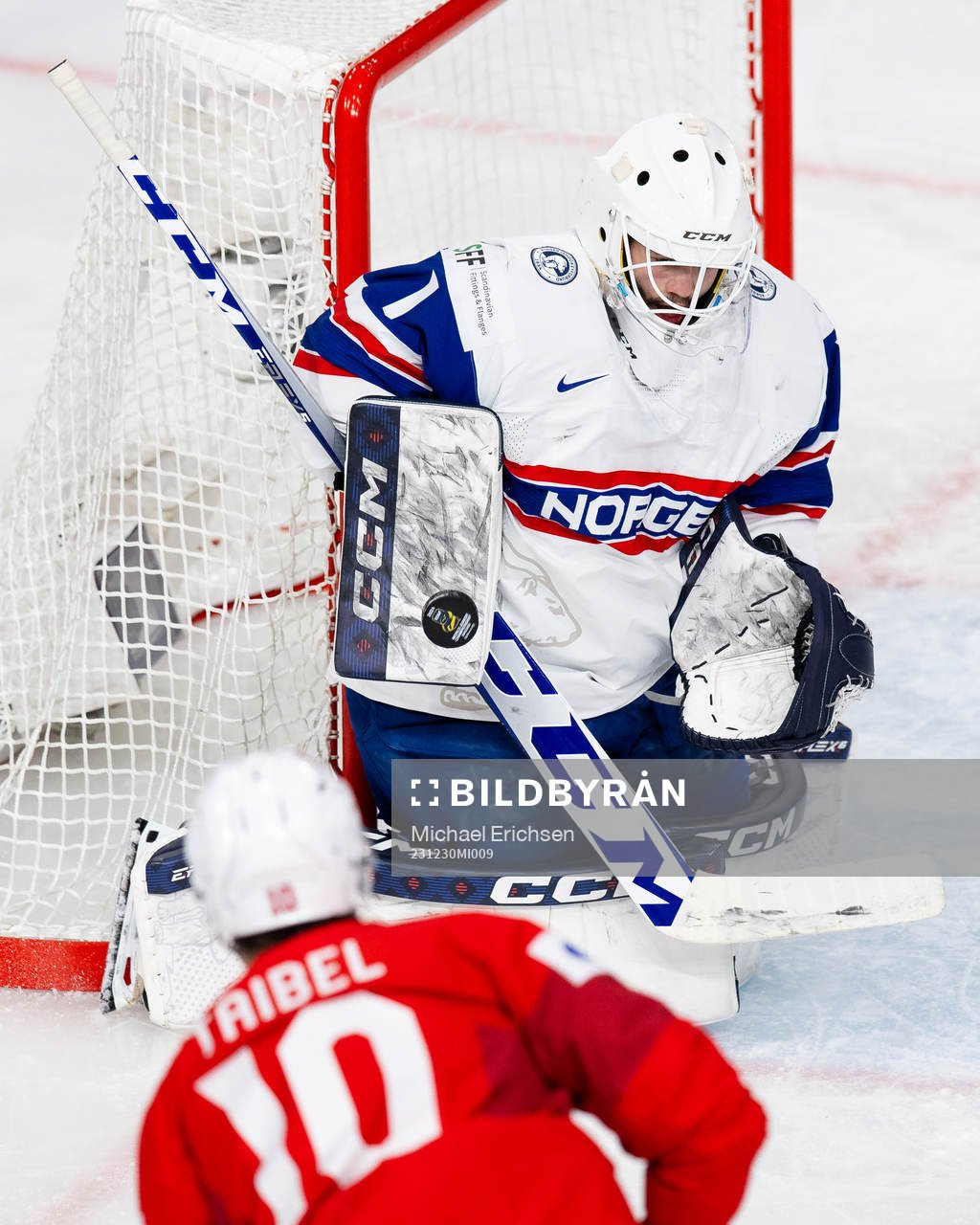 Goaltender Markus Stensrud saves a shot from Jonas Taibel