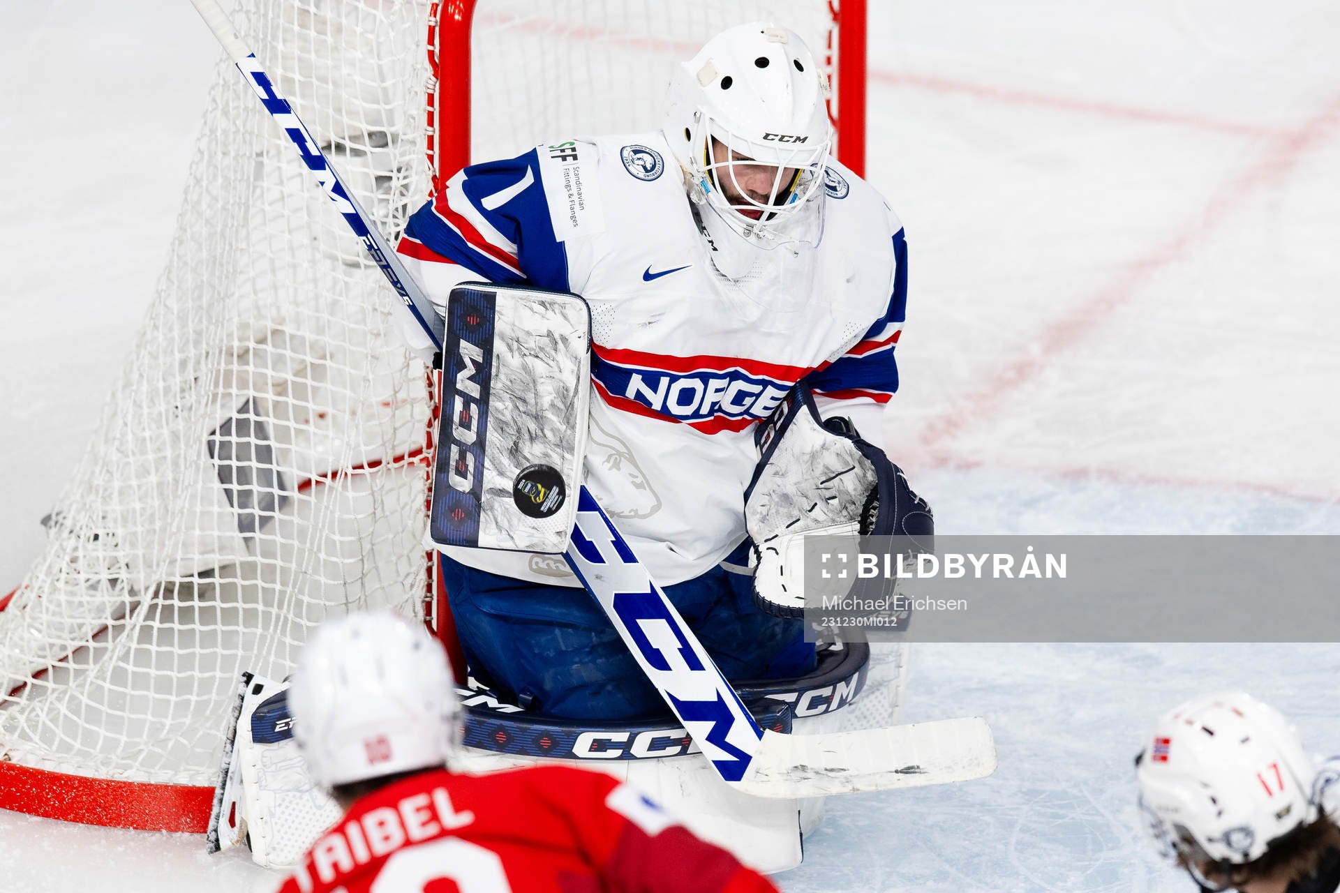 Goaltender Markus Stensrud saves a shot from Jonas Taibel
