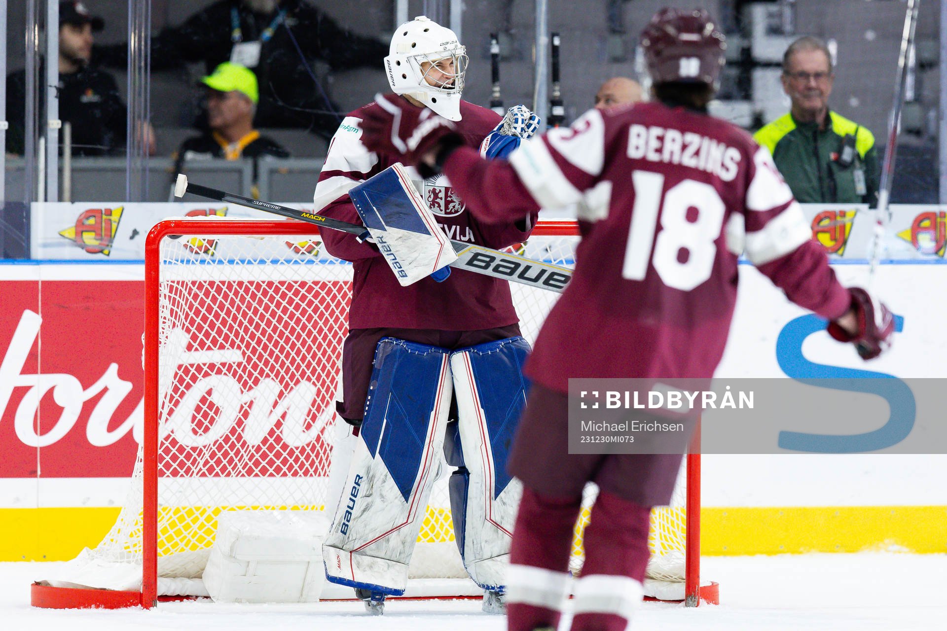 Goaltender Deivs Rolovs of Latvia celebrates