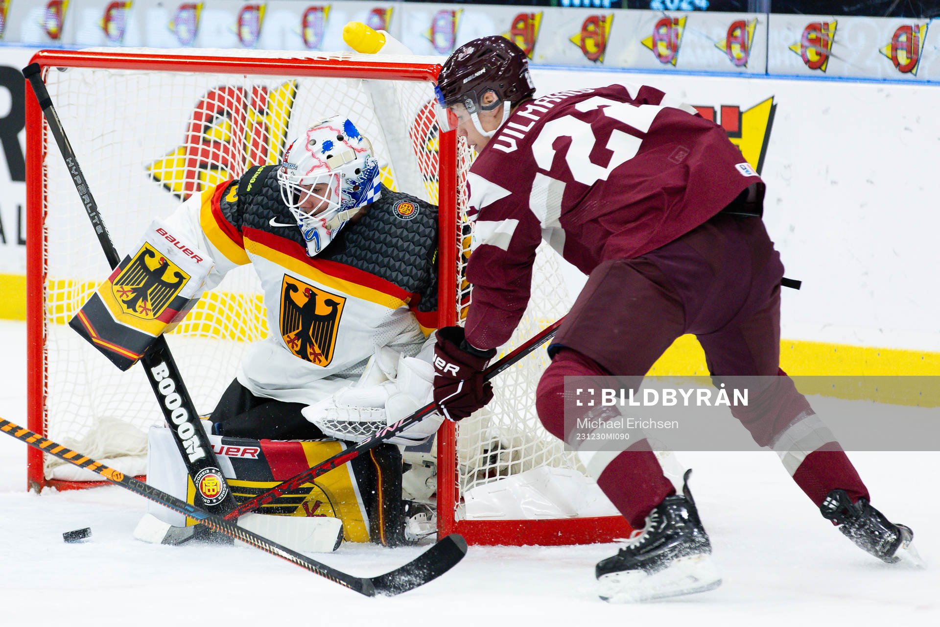 Goaltender Philipp Dietl of Germany and Sandis Vilmanis of