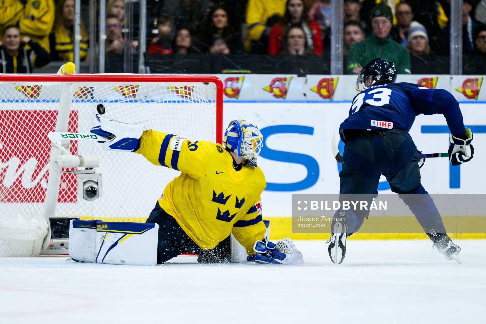 Goaltender Melker Thelin of Sweden and Jani Nyman of Finland