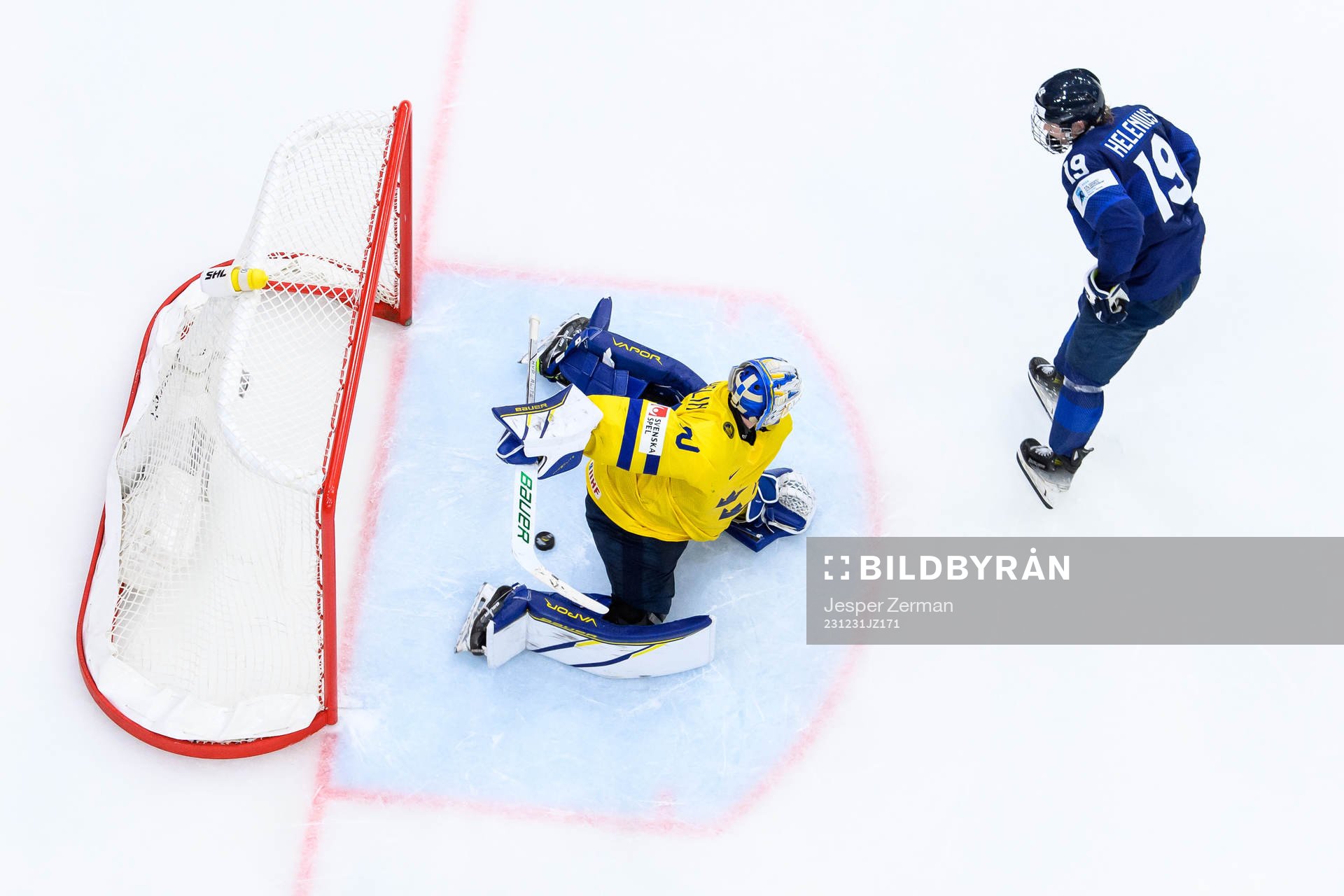 goaltender Melker Thelin of Sweden and Konsta Helenius of