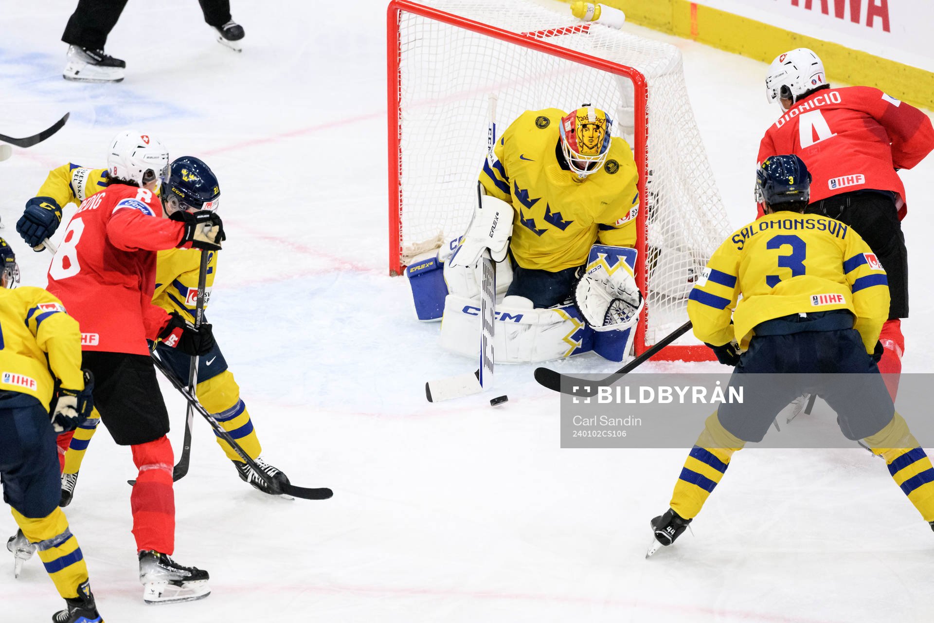 Goaltender Hugo Hävelid of Sweden and Rodwin Dionicio of