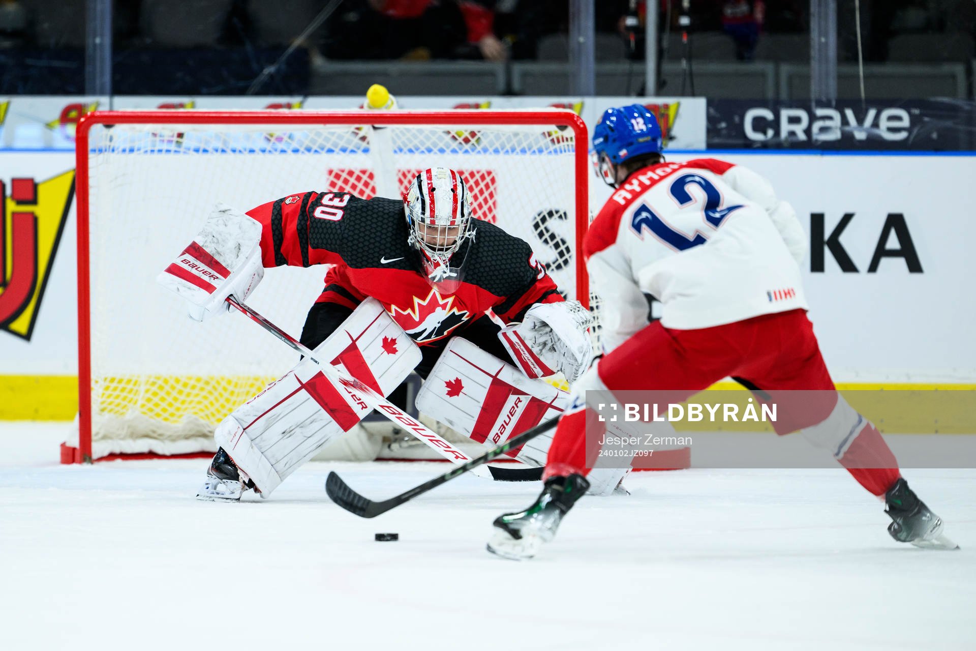 goalkeeper Mathis Rousseau of Canada and Dominik Rymon of