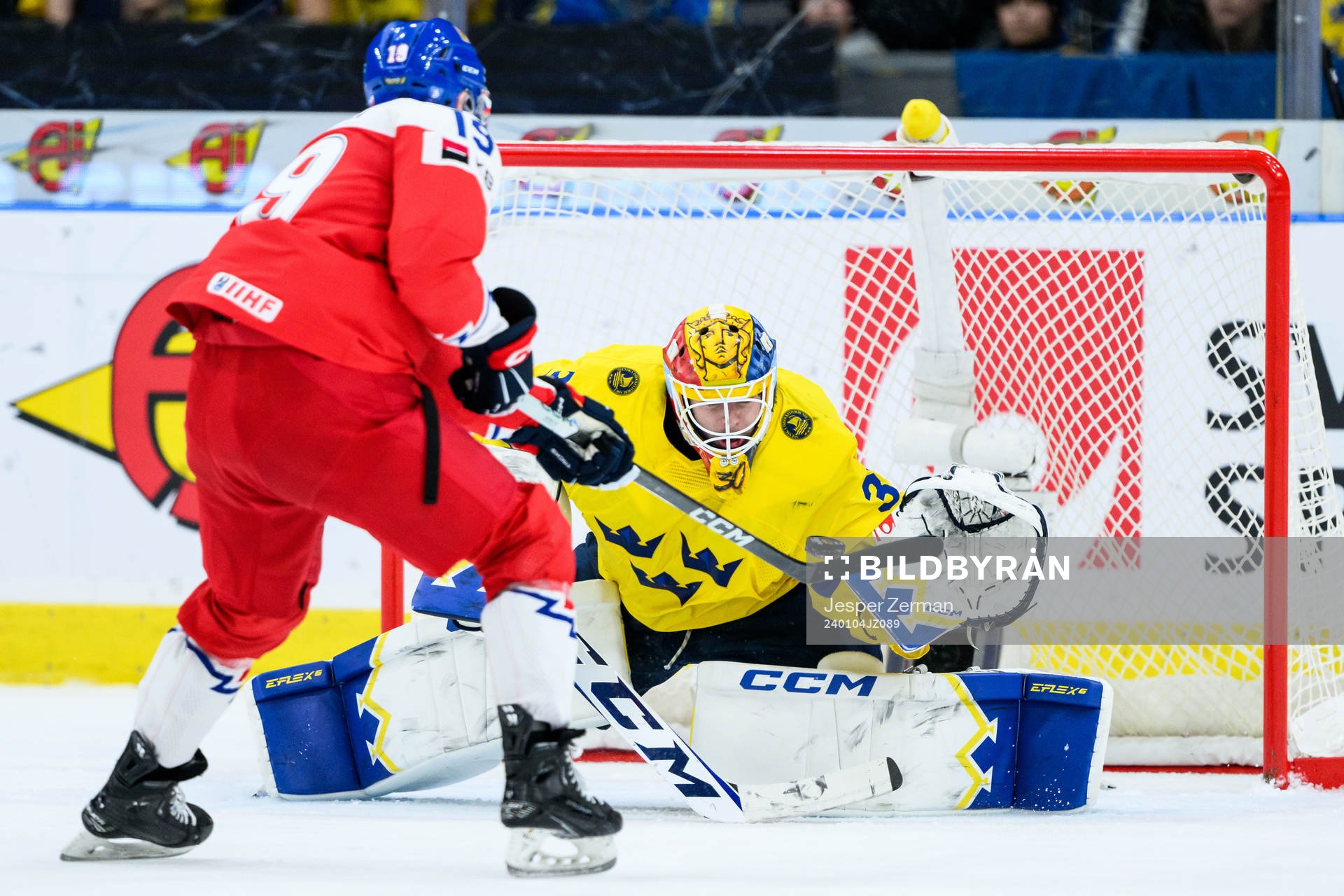 Goaltender Hugo Hävelid of Sweden and Ondrej Becher of