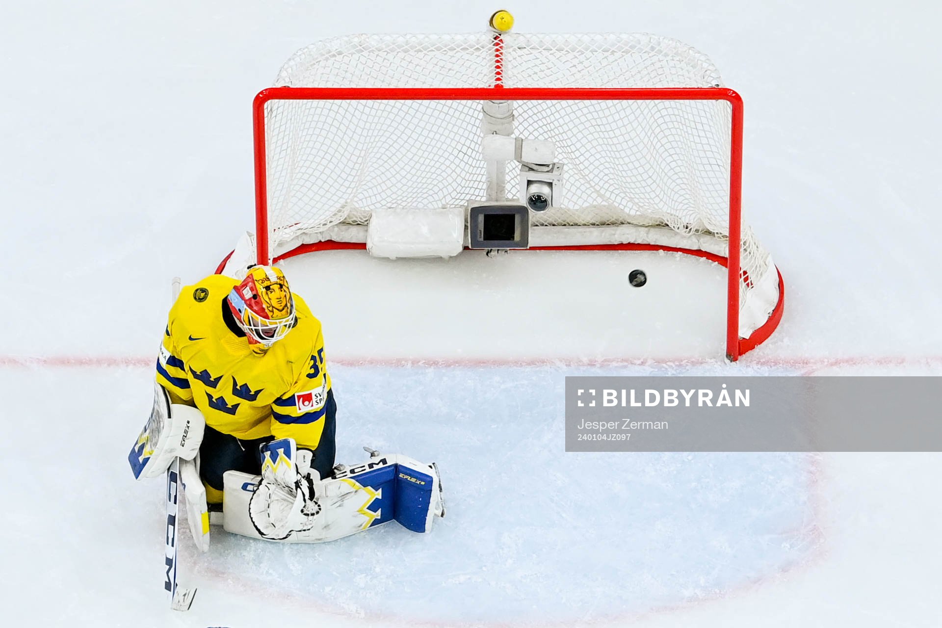 Goaltender Hugo Hävelid of Sweden looks dejected