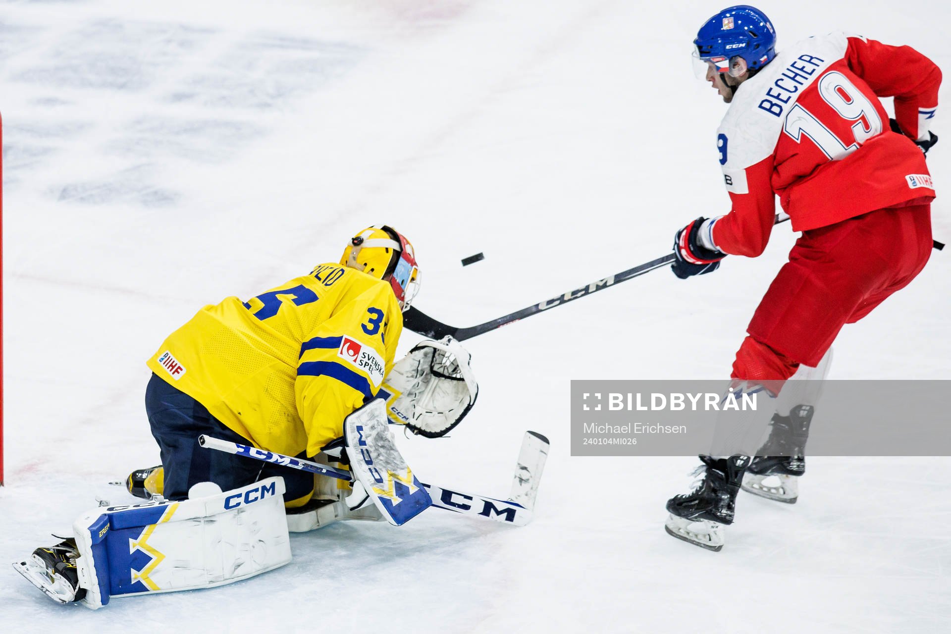 Goaltender Hugo Hävelid of Sweden and Ondrej Becher of