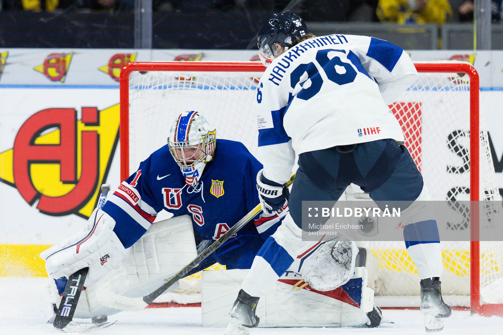 Goaltender Trey Augustine of USA and Janne Naukkarinen of