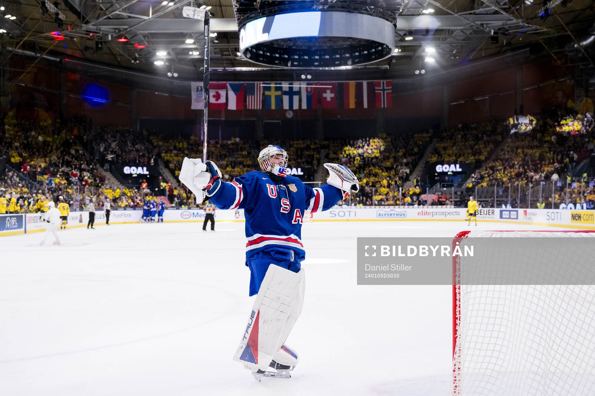 Goaltender Trey Augustine of USA celebrates