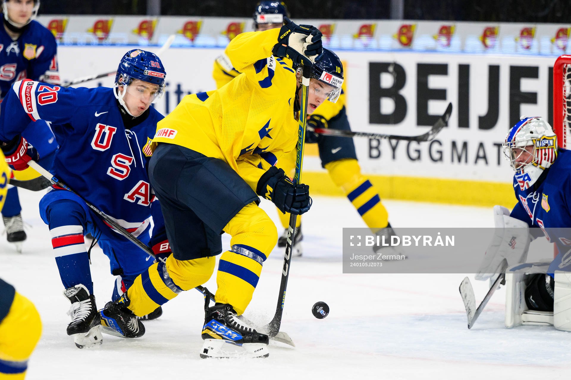 Lane Hutson and goaltender Trey Augustine of USA and Fabian