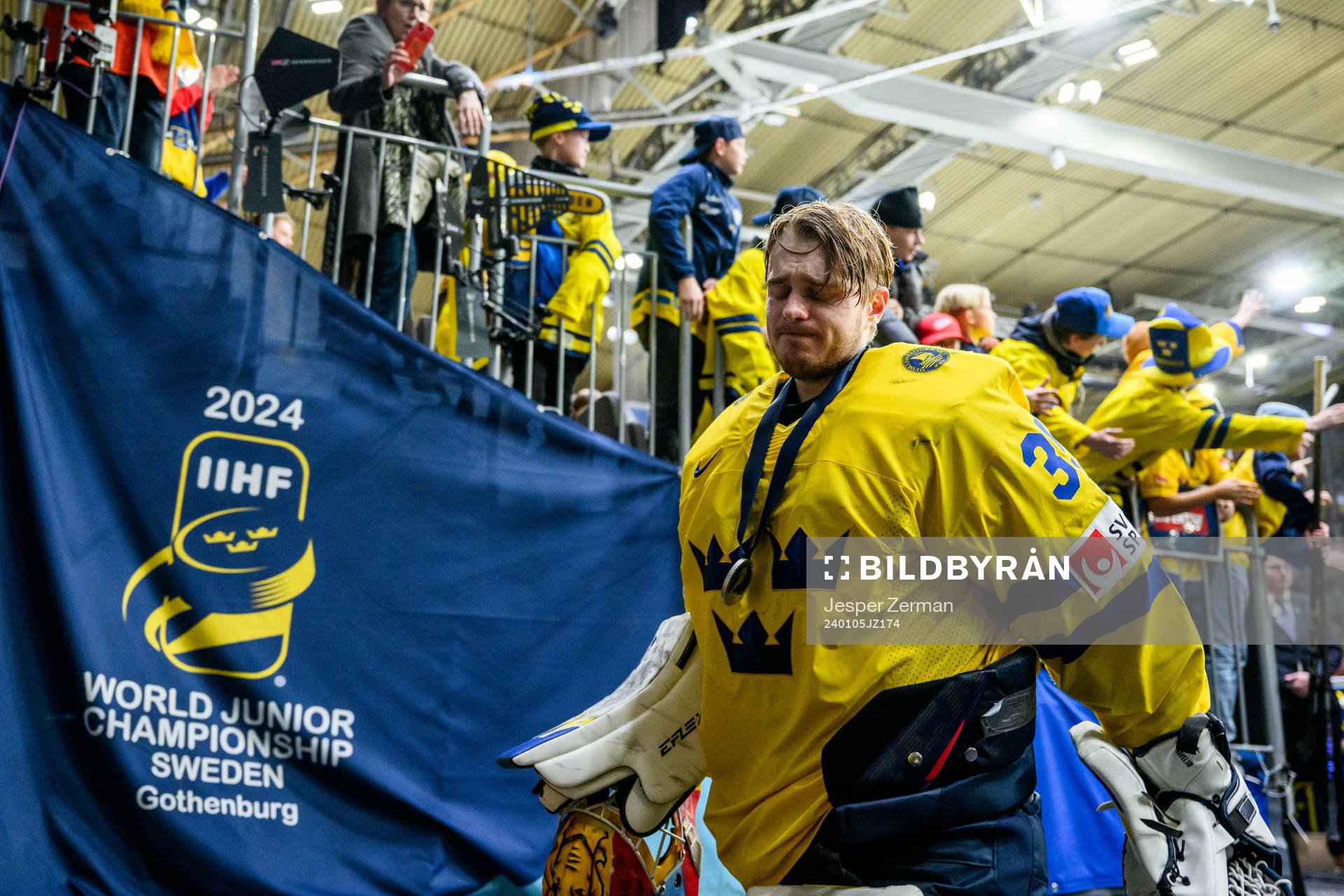 Goaltender Hugo Hävelid of Sweden looks dejected