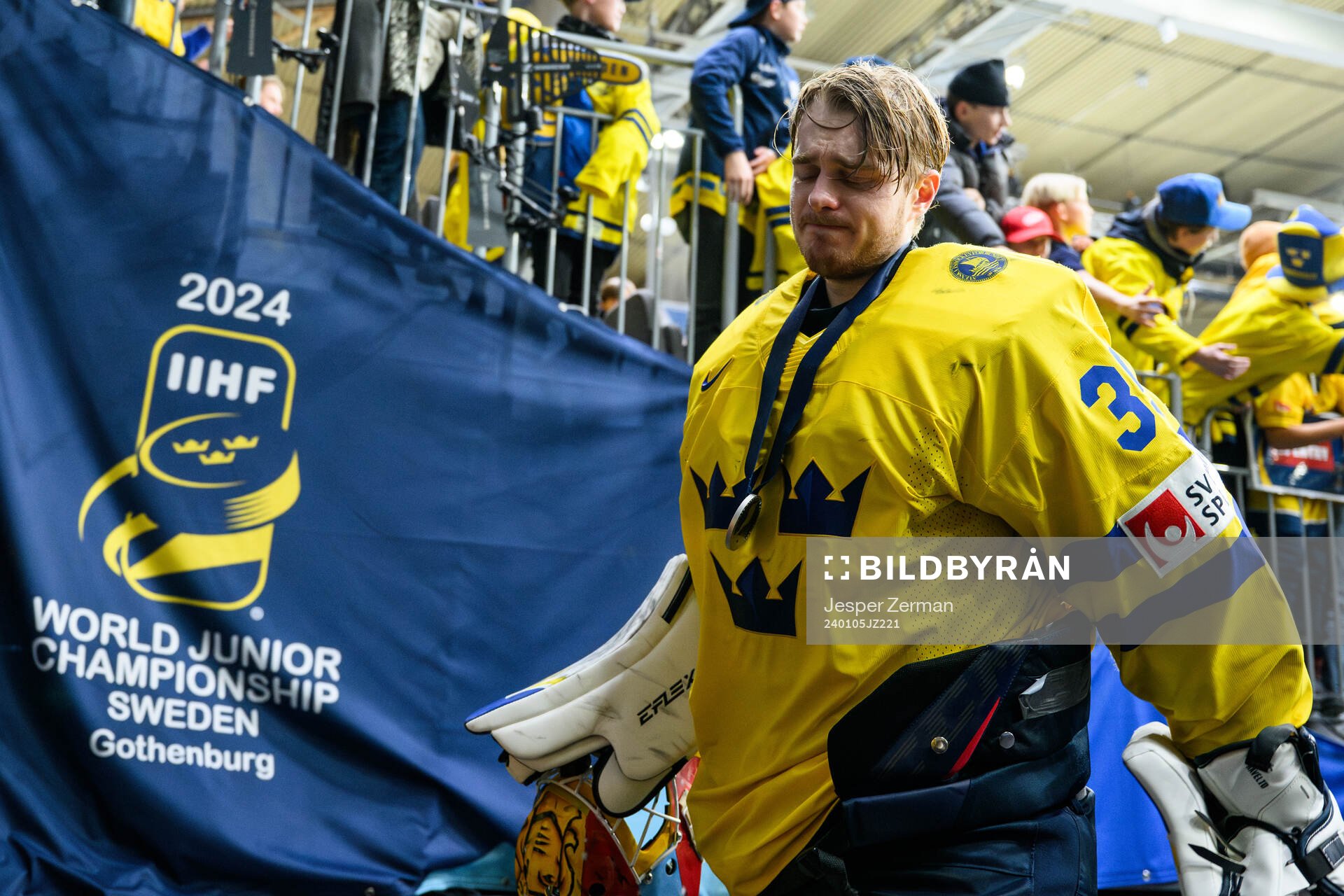 Goaltender Hugo Hävelid of Sweden looks dejected