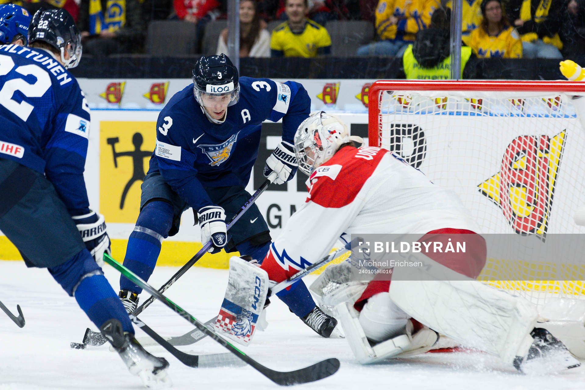 Otto Salin of Finland and goaltender Jakub Vondras of Czech