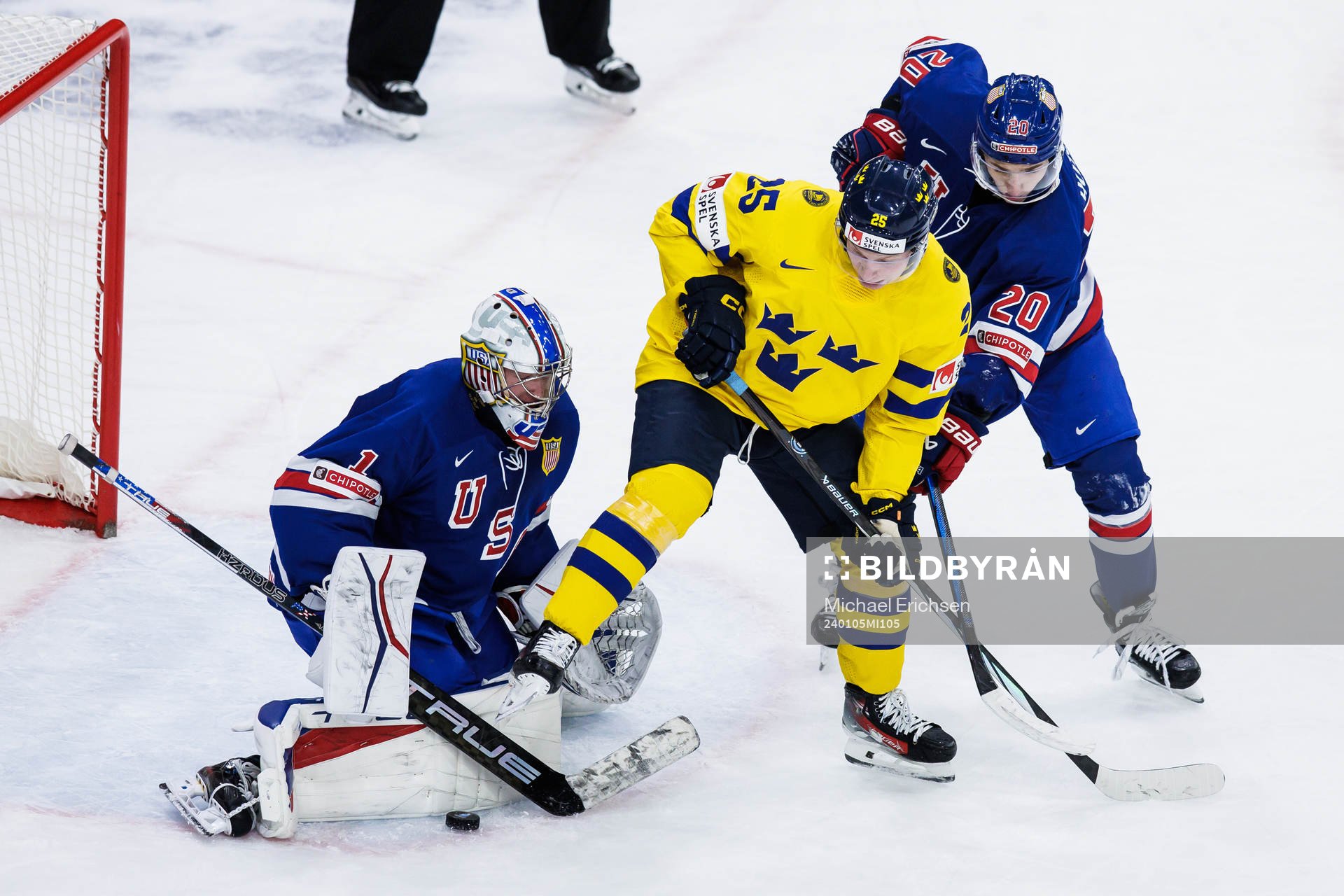 Goaltender Trey Augustine and Lane Hutson of USA and Otto