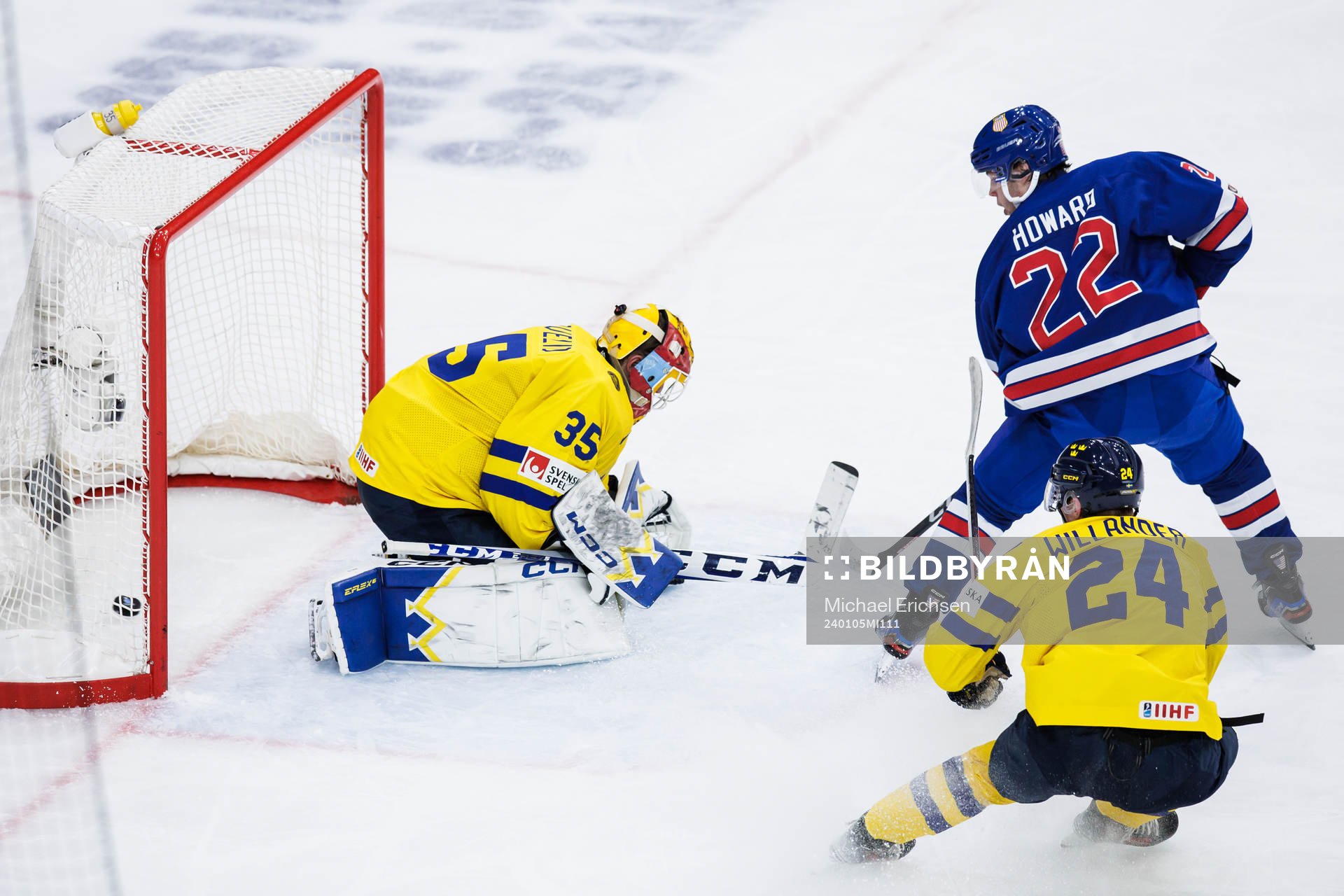 Isaac Howard of USA scores the 2-1 goal behind goaltender