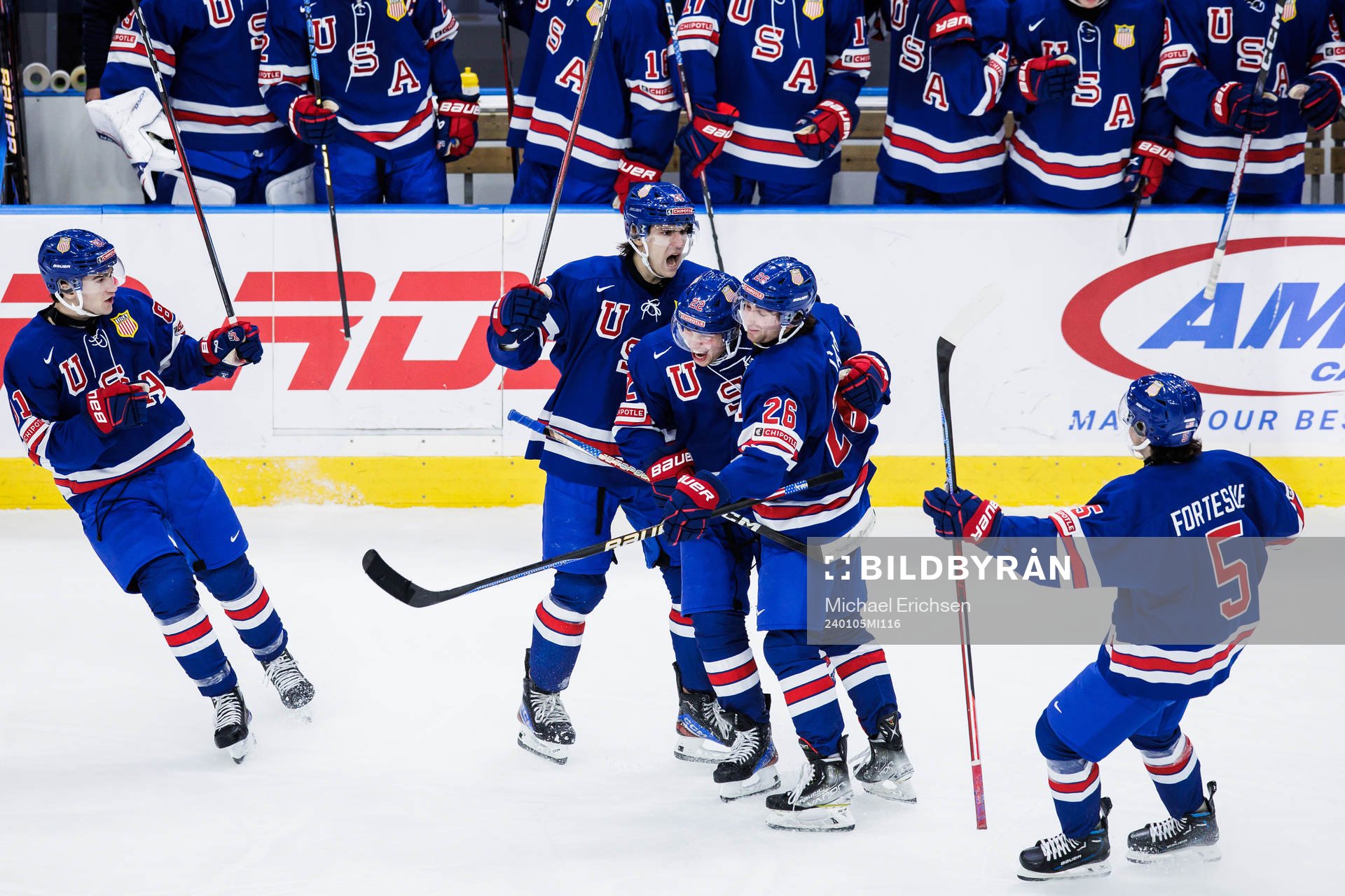 Cutter Gauthier and Seamus Casey celebrate with Isaac Howard